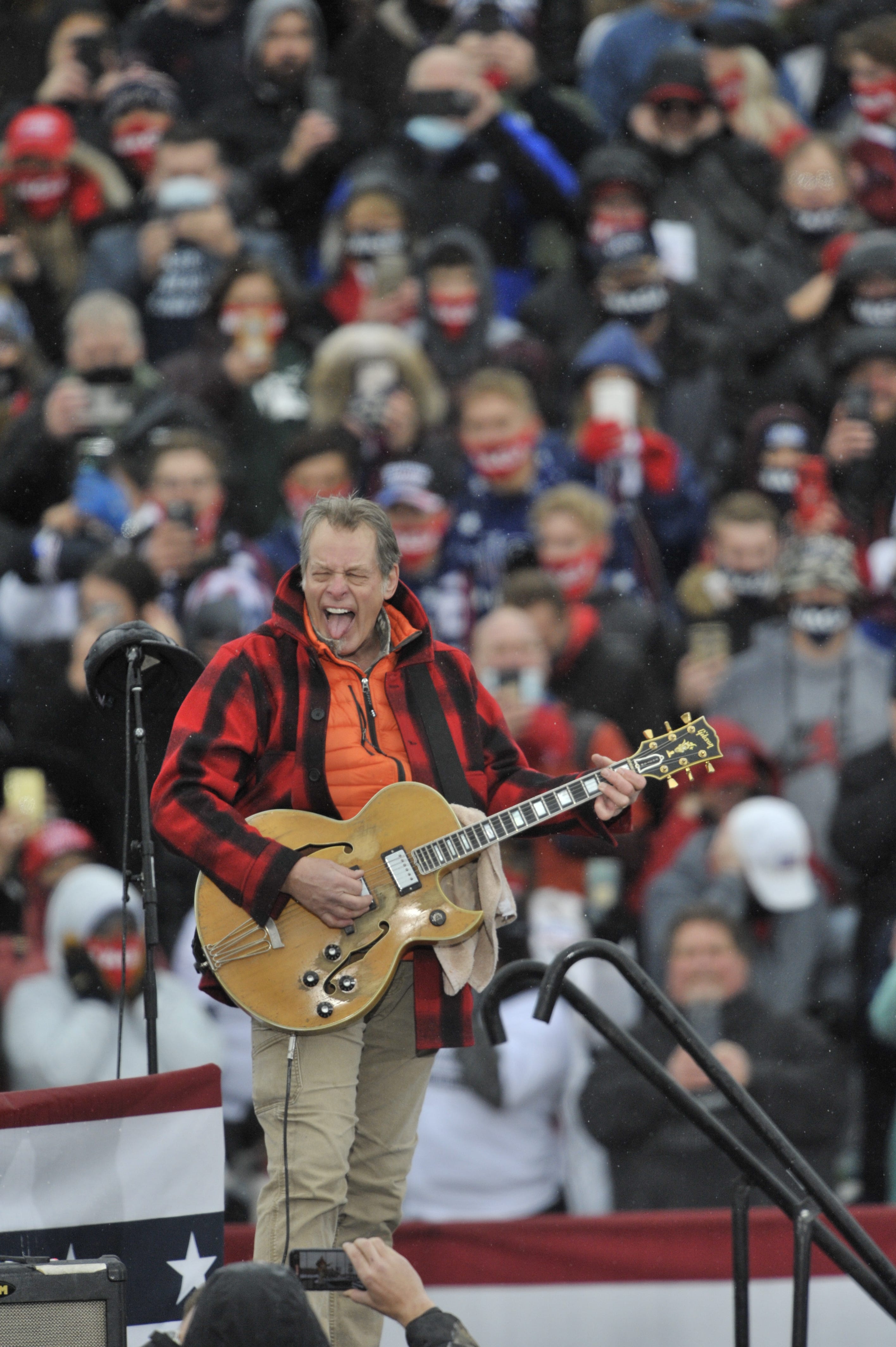 Ted Nugent plays The National Anthem before President Donald Trump addresses supporters during his Make America Great Again Victory Rally at AV Flight at the Capital Region International Airport in Lansing, Tuesday, October 27, 2020.