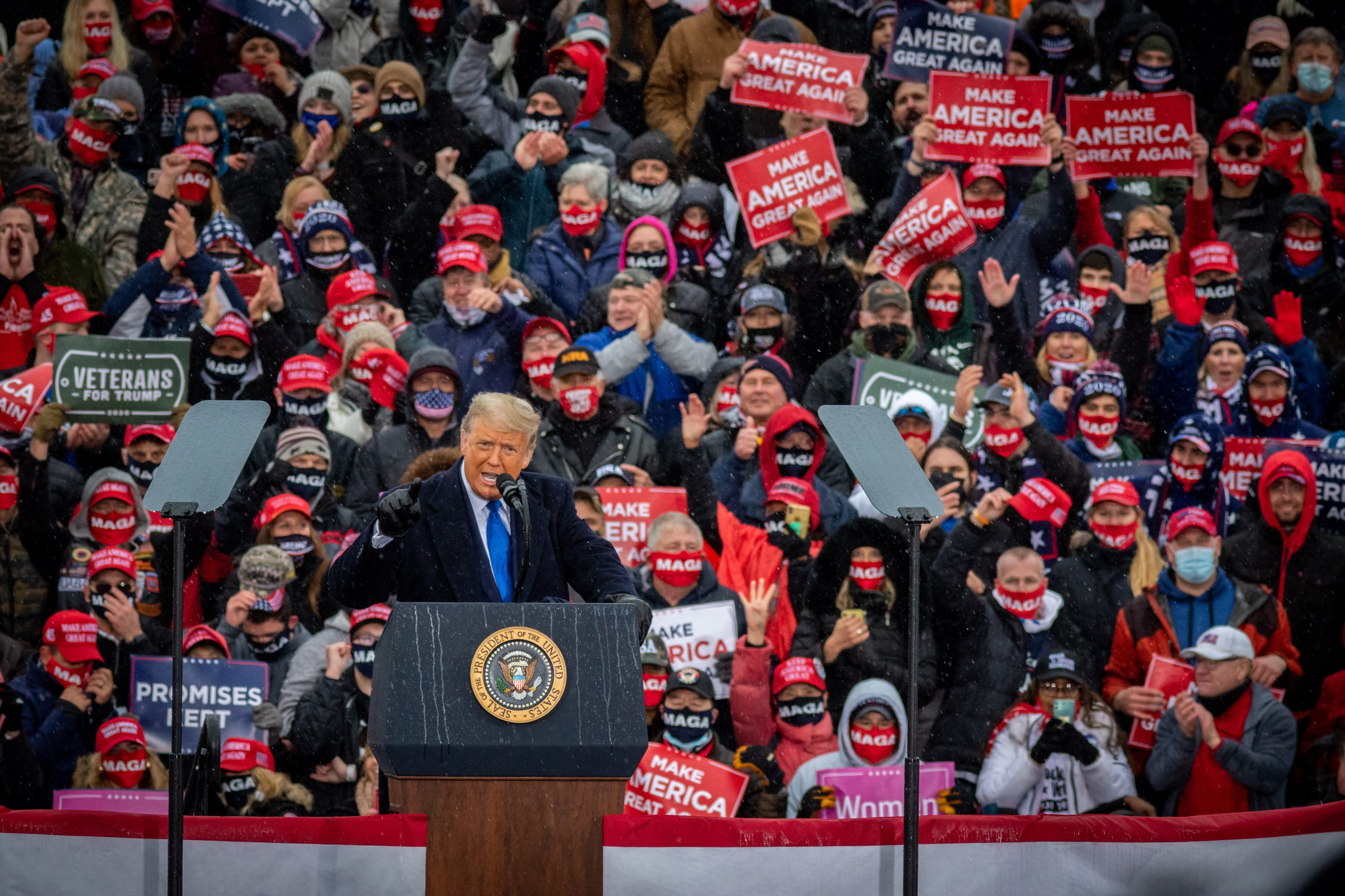 President Donald Trump gives a campaign speech in Lansing, Michigan.