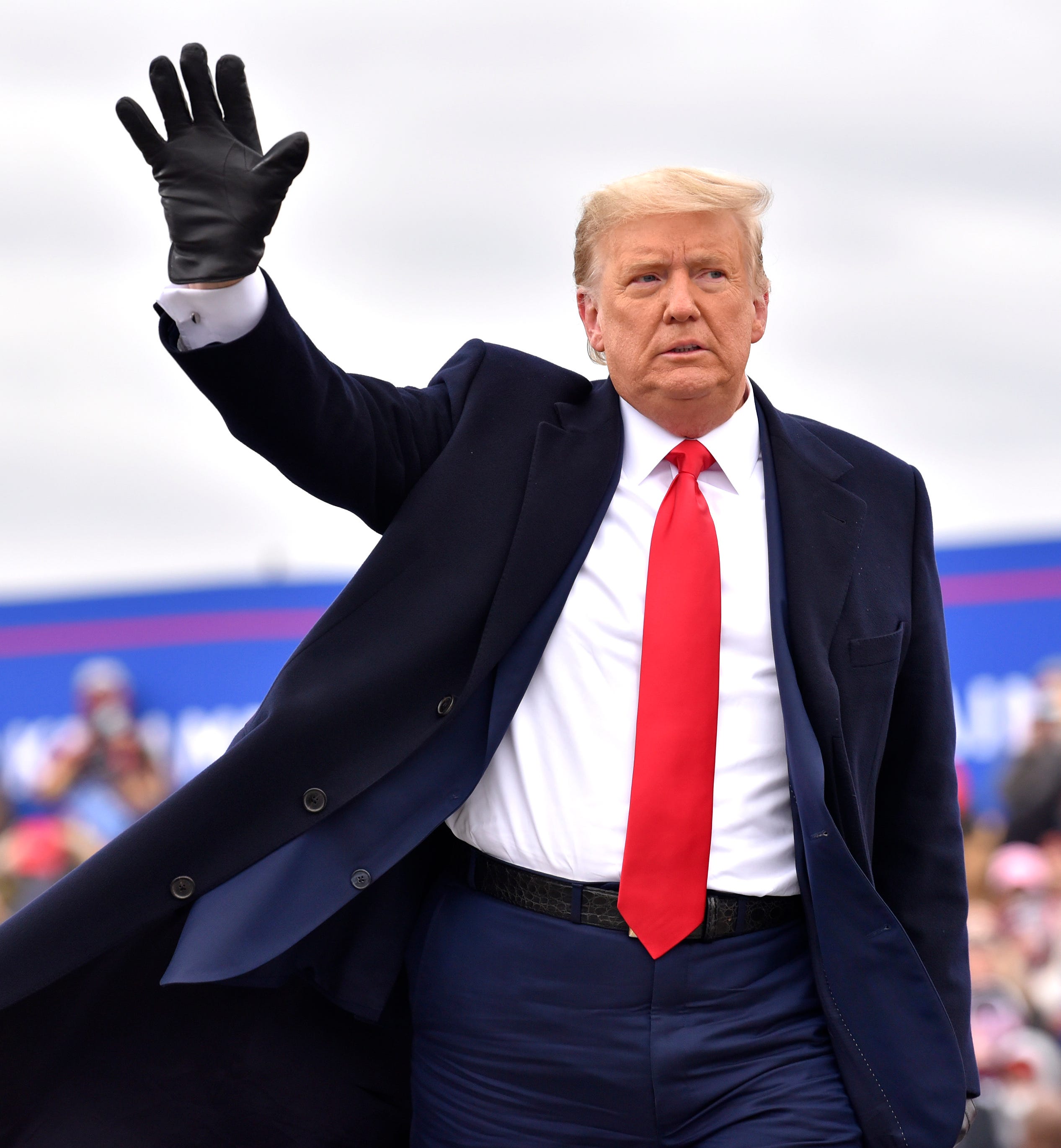 President Trump waves to supporters after speaking at the Oakland International Airport in Waterford Twp., Friday, October 30, 2020, for his Make America Great Again Victory Rally.