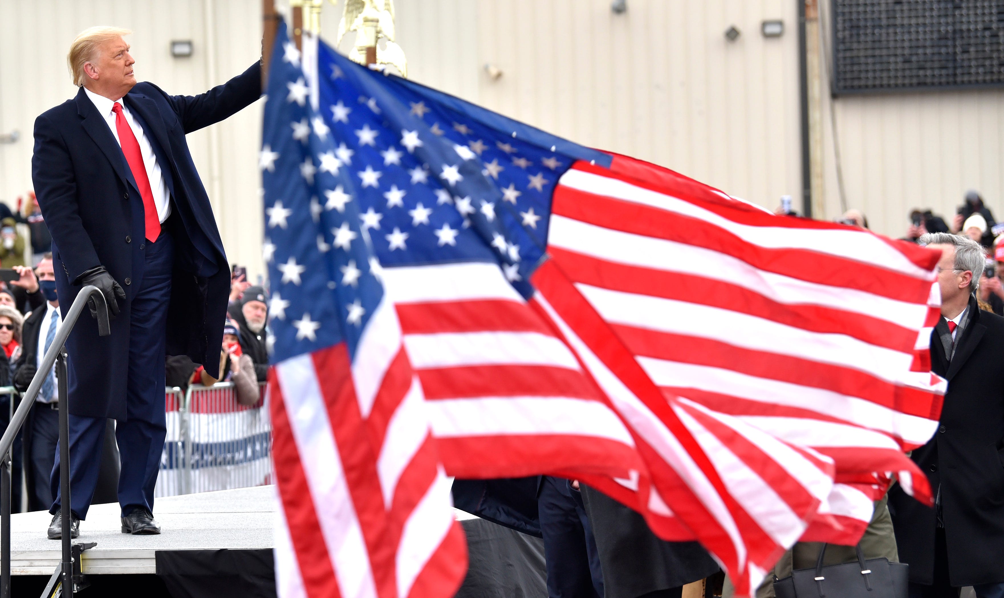 President Trump waves to supporters after speaking at the Oakland International Airport in Waterford Twp., Friday, October 30, 2020, for his Make America Great Again Victory Rally.