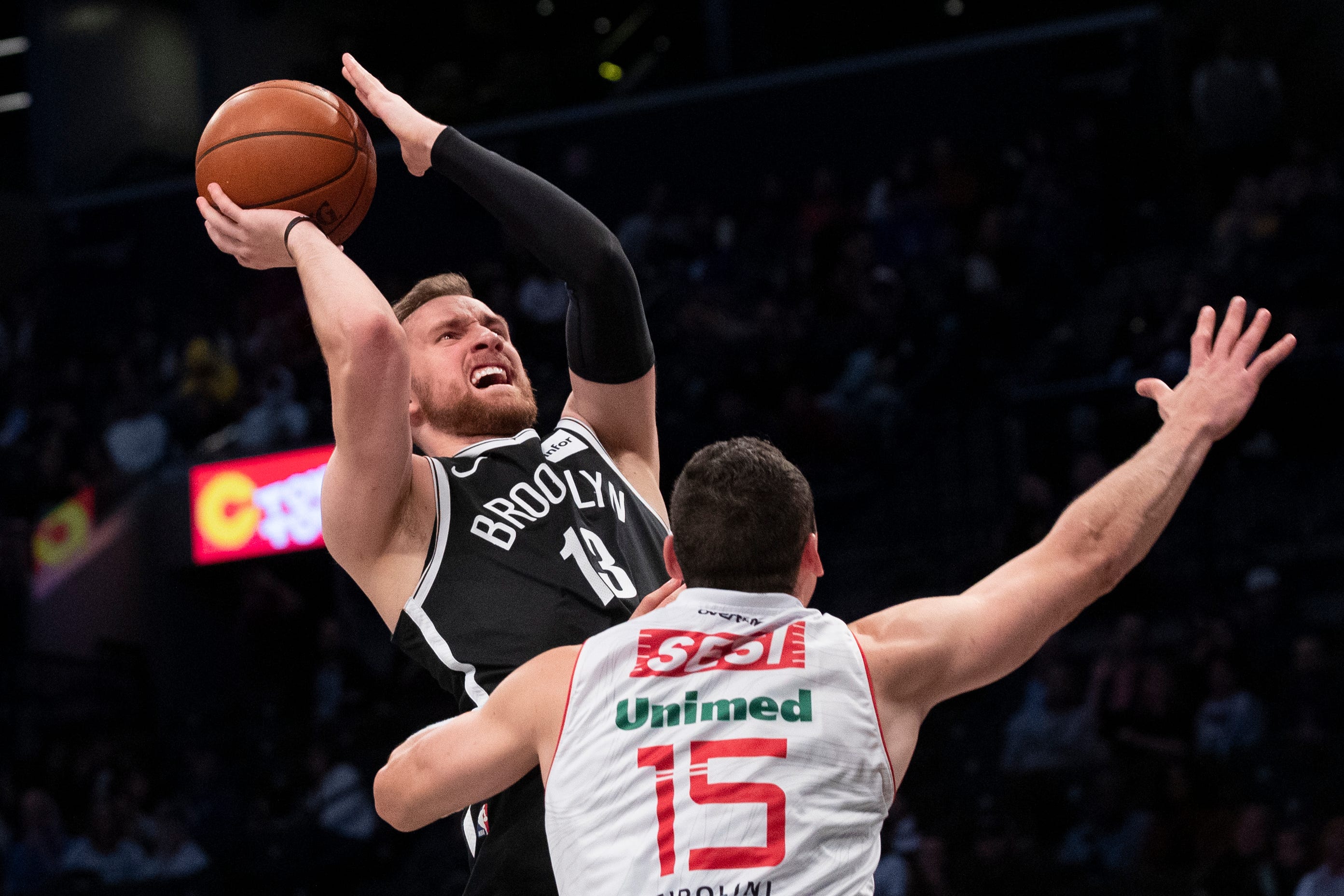Brooklyn Nets guard Dzanan Musa (13) goes to the basket against Sesi/Franca Basketball Club center Lucas Cipolini Alves (15) during the second half of an exhibition NBA basketball game, Friday, Oct. 4, 2019, in New York.