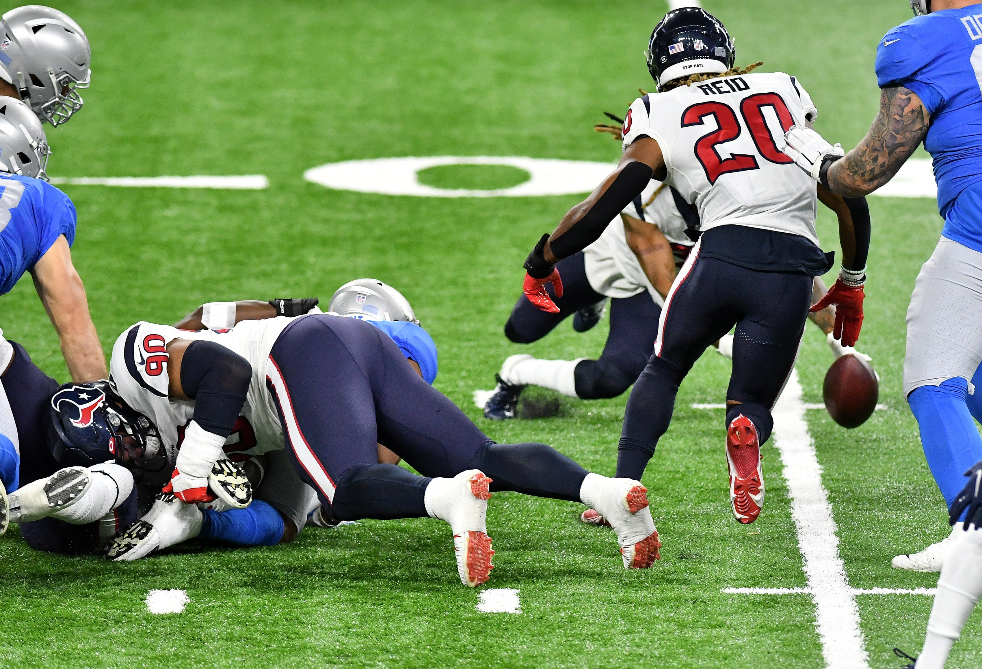 Texans cornerback Bradley Roby (21), rear and Texans strong safety Justin Reid (20) about to recover a fumble by Lions running back Jonathan Williams (41) under Texans defensive tackle Ross Blacklock (90) in the first half.