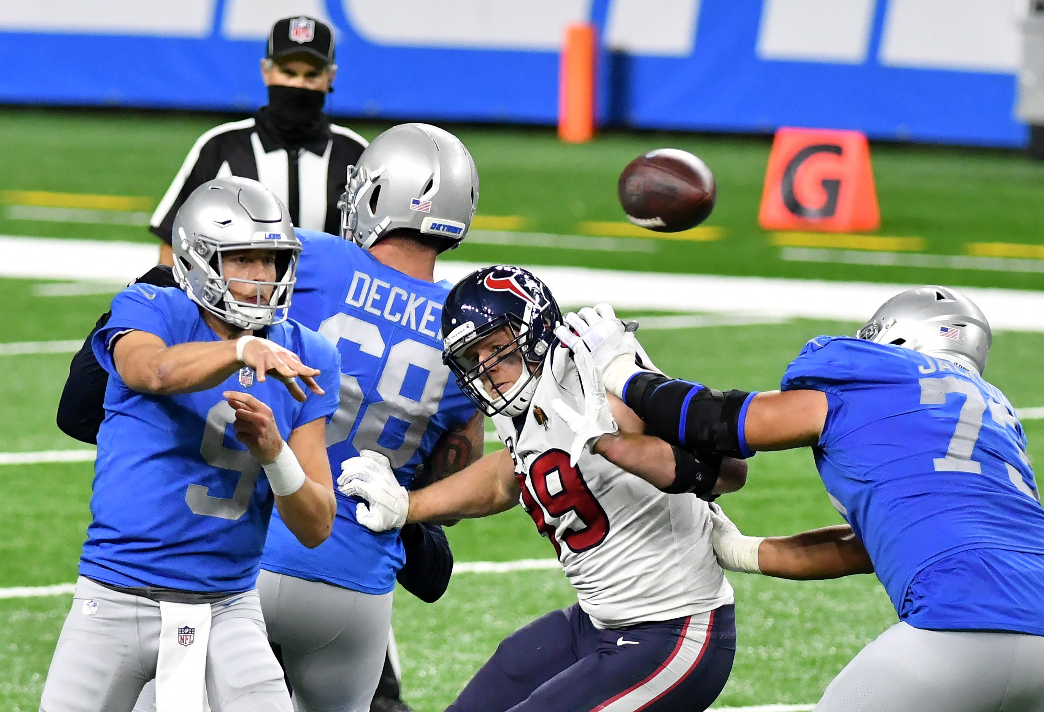 Lions offensive guard Jonah Jackson (73) blocks Texans defensive end J.J. Watt (99) while Lions quarterback Matthew Stafford (9) passes in the fourth quarter.