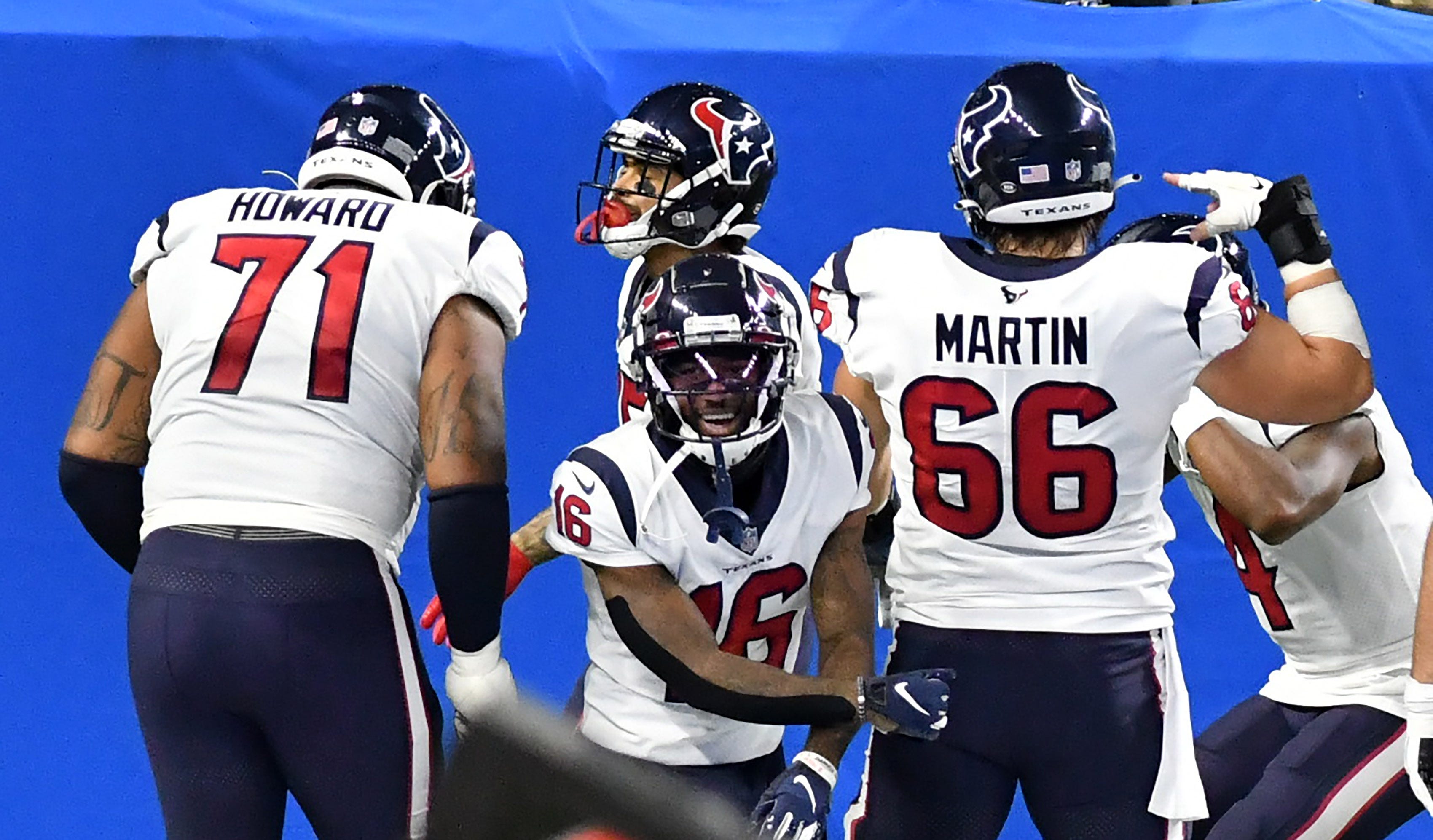 Texans offensive tackle Tytus Howard (71), wide receiver Keke Coutee (16), and center Nick Martin (66) celebrate a touchdown by wide receiver Will Fuller (15) in the fourth quarter.