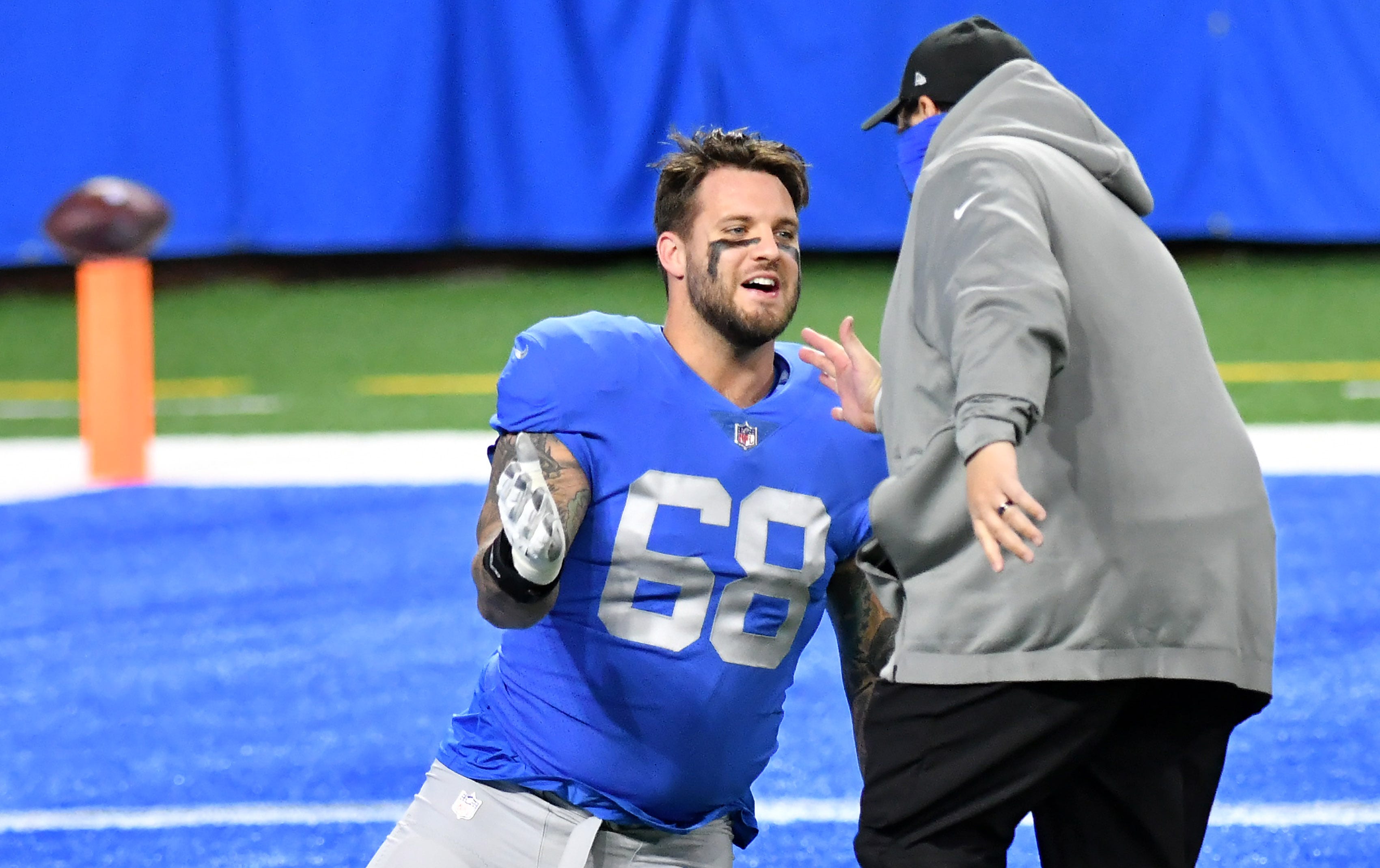 Lions head coach Matt Patricia greets Lions offensive tackle Taylor Decker (68) before the game.