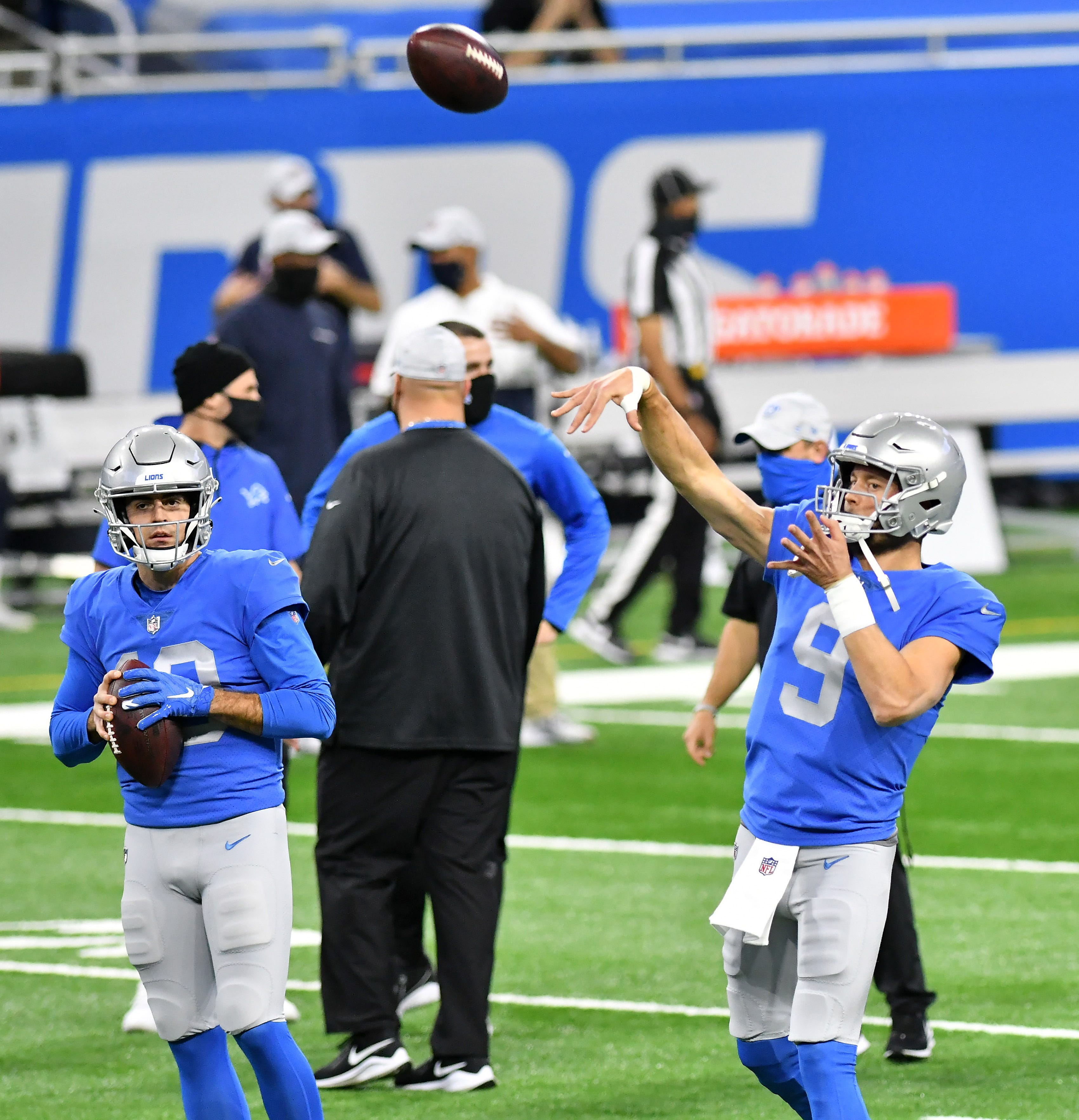 Lions quarterback Matthew Stafford (9) warms up next to Lions quarterback David Blough (10) before the game.