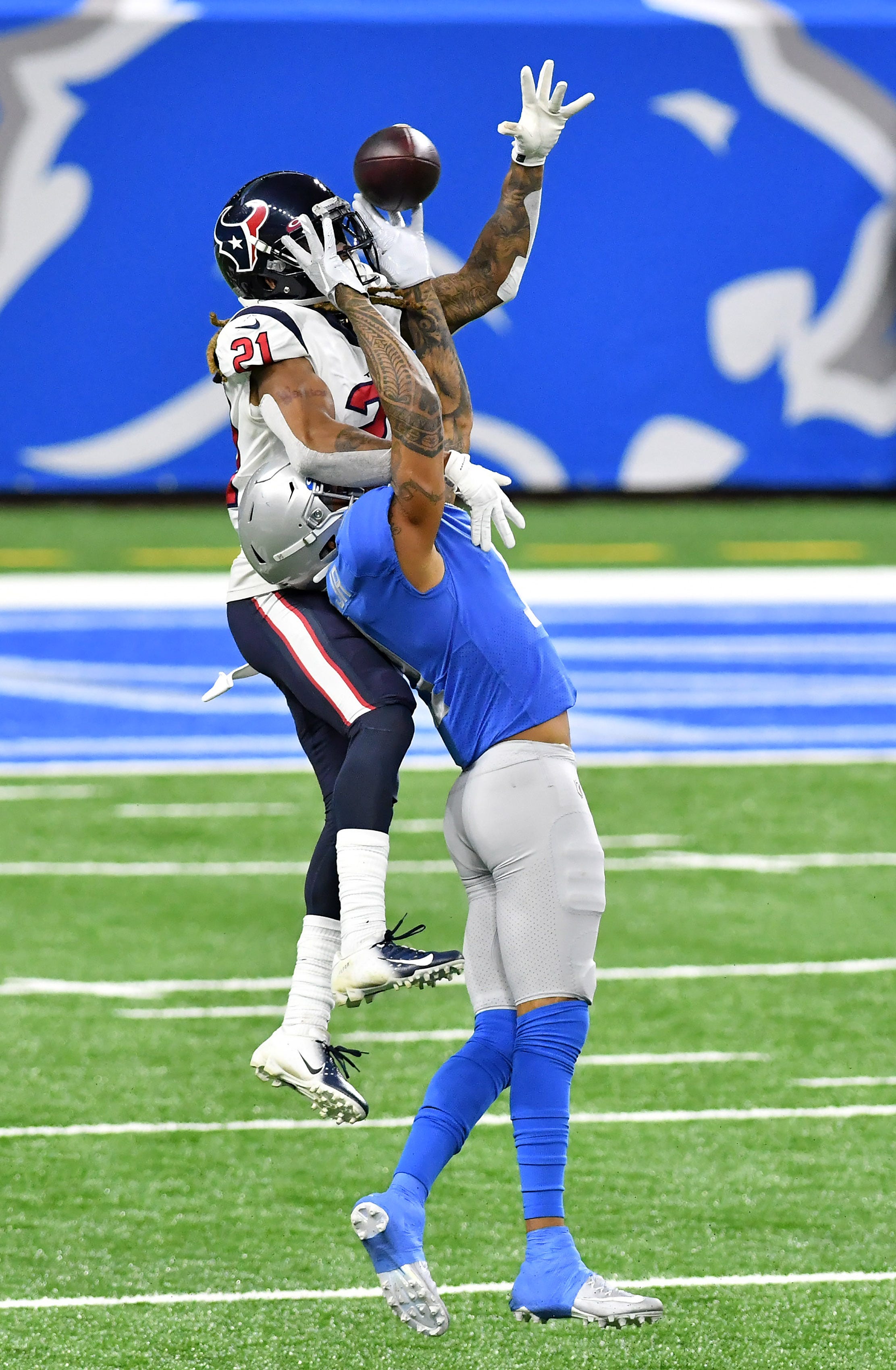Texans cornerback Bradley Roby (21) breaks up this pass intended for Lions wide receiver Marvin Jones Jr. (11)  in the third quarter.  Detroit Lions vs Houston Texans on Thanksgiving Day at Ford Field in Detroit on Nov. 26, 2020.  Texans win 41-25.