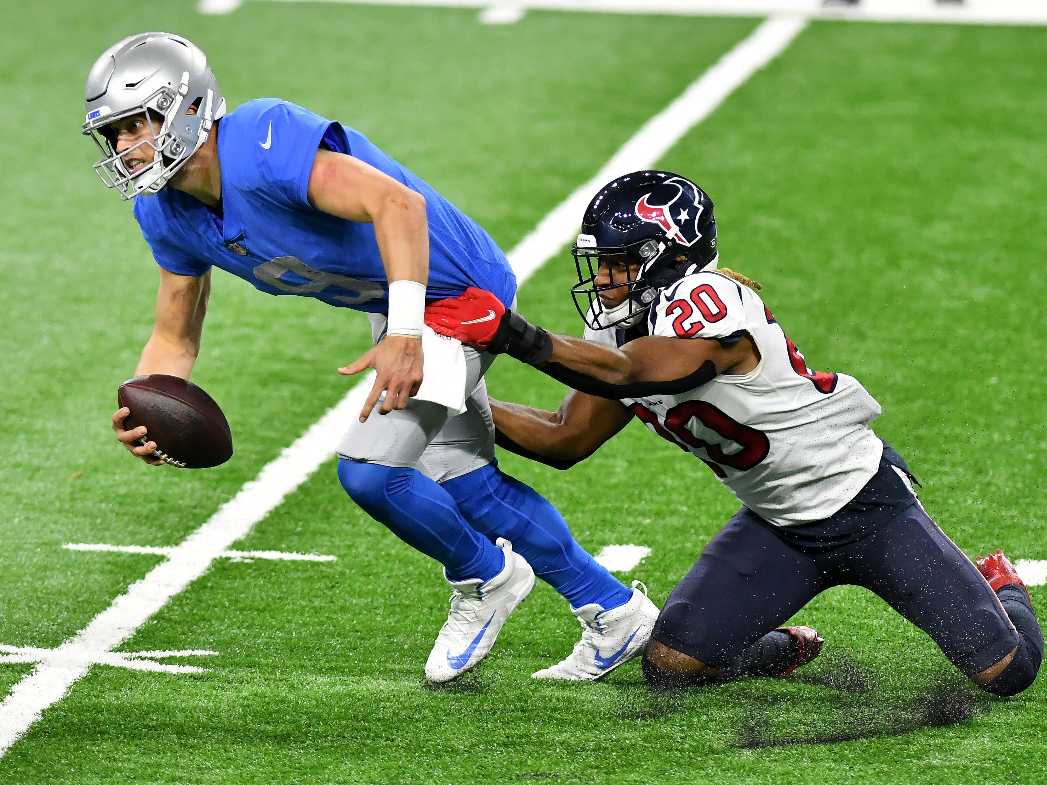 Texans strong safety Justin Reid (20) starts the sack of Lions quarterback Matthew Stafford (9) in the third quarter.