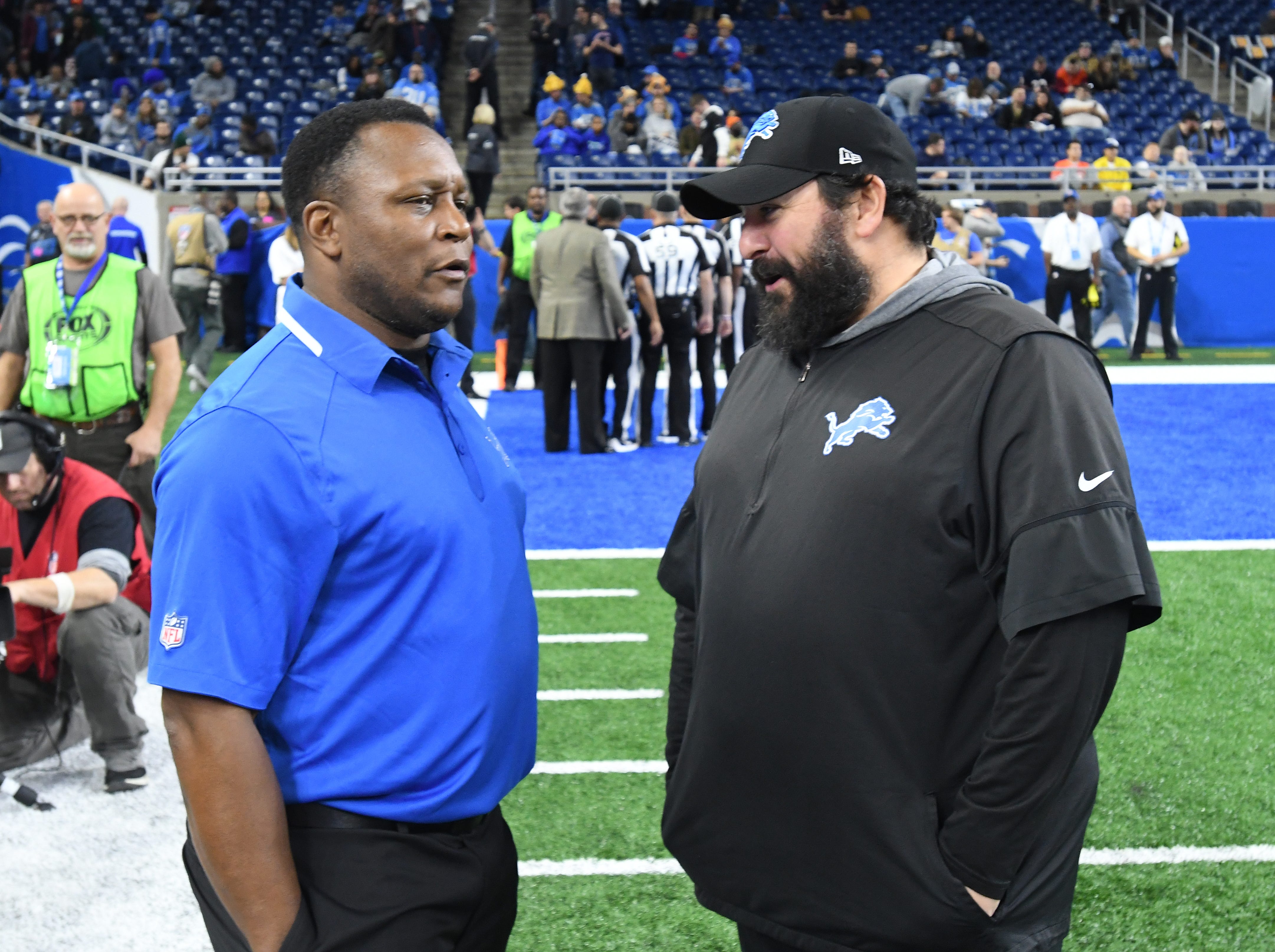 NFL Hall of Fame running back Barry Sanders chats with Lions head coach Matt Patricia before the game against the Chicago Bears on November 28, 2019.