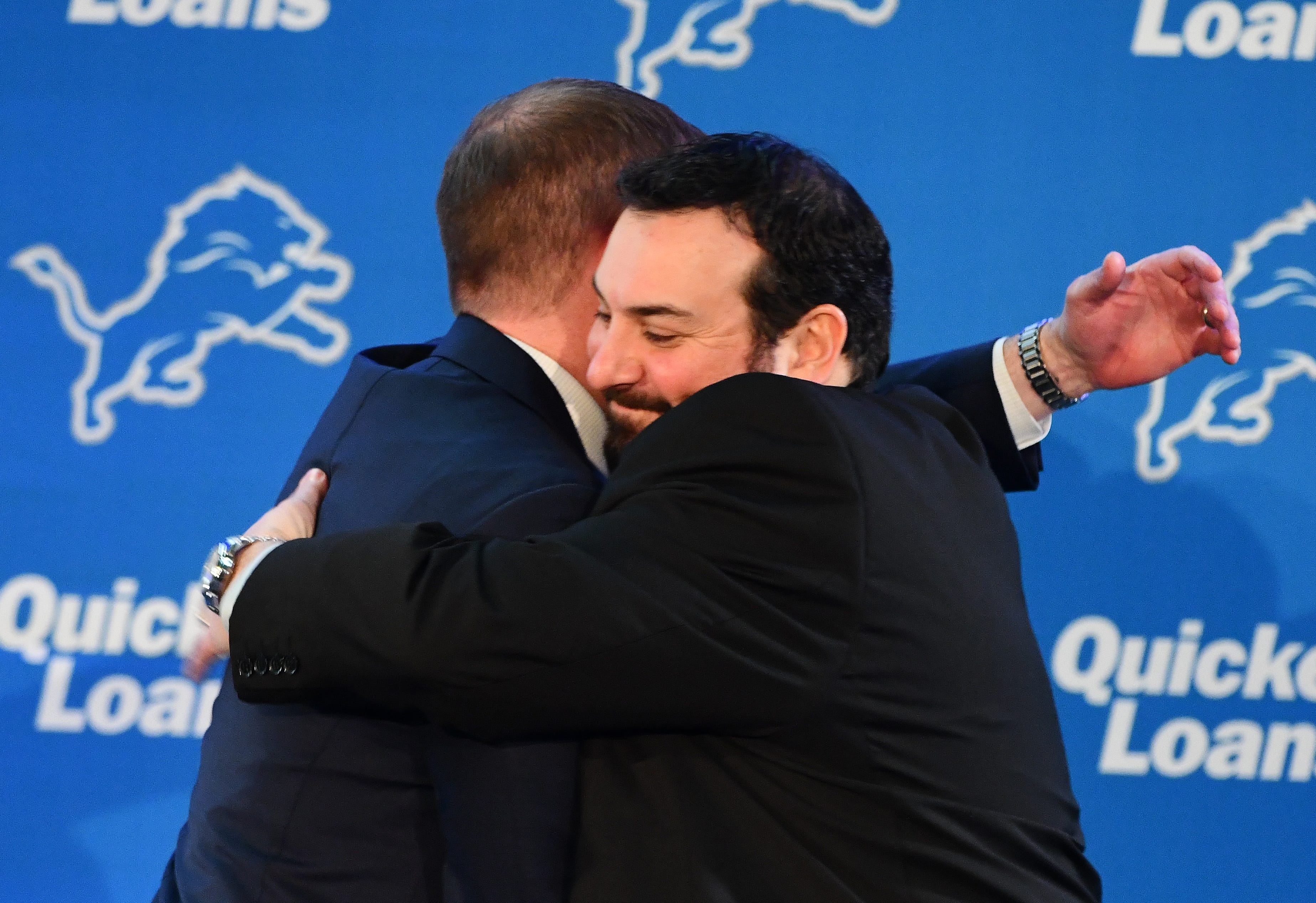 New Detroit Lions head coach Matt Patricia hugs Lions GM Bob Quinn during the introductory press conference at training facility in Allen Park, Michigan on February 7, 2018.