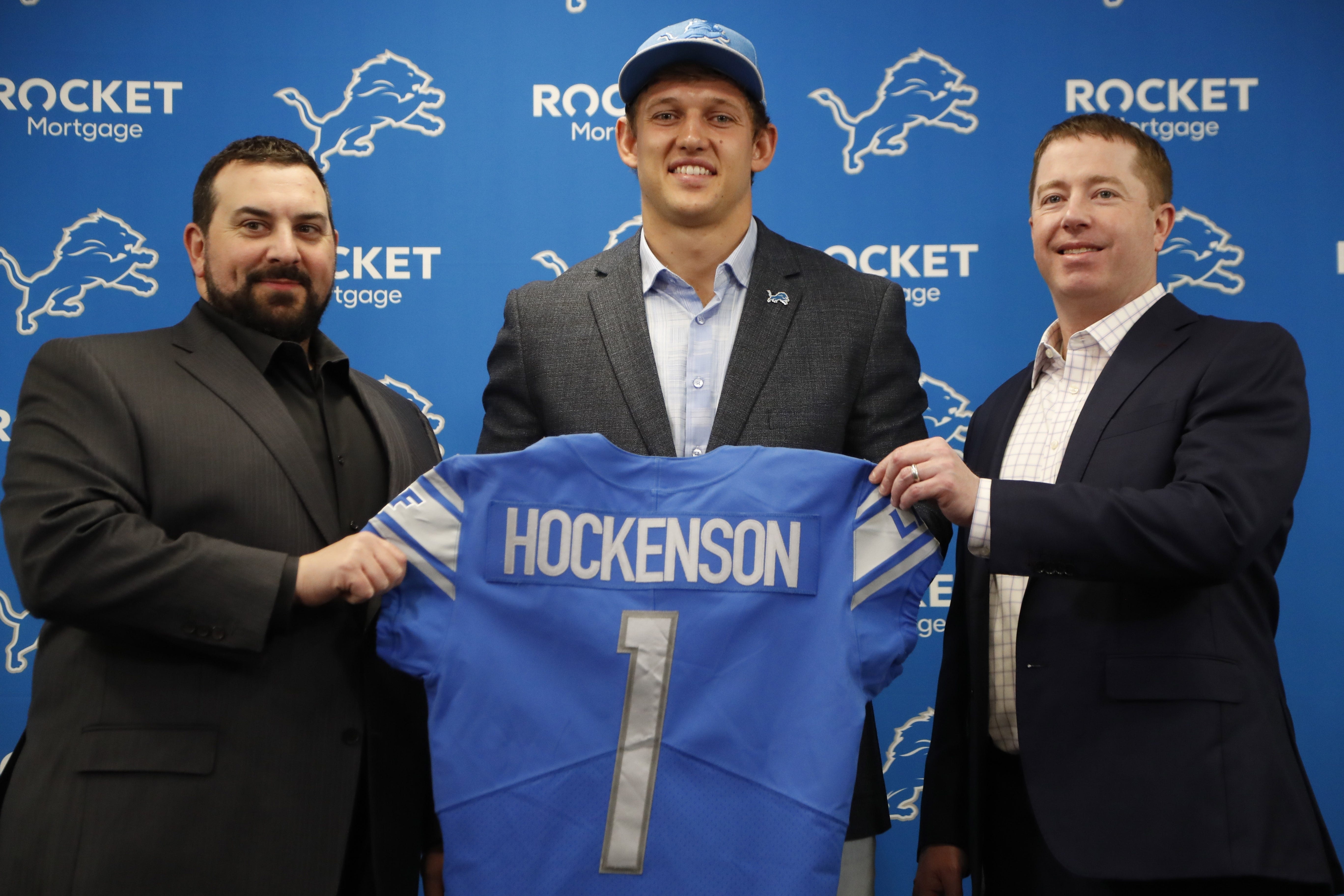 Detroit Lions first-round draft pick T.J. Hockenson stands with team general manager Bob Quinn, right, and head coach Matt Patricia at the Lions training facility, Friday, April 26, 2019, in Allen Park, Mich.