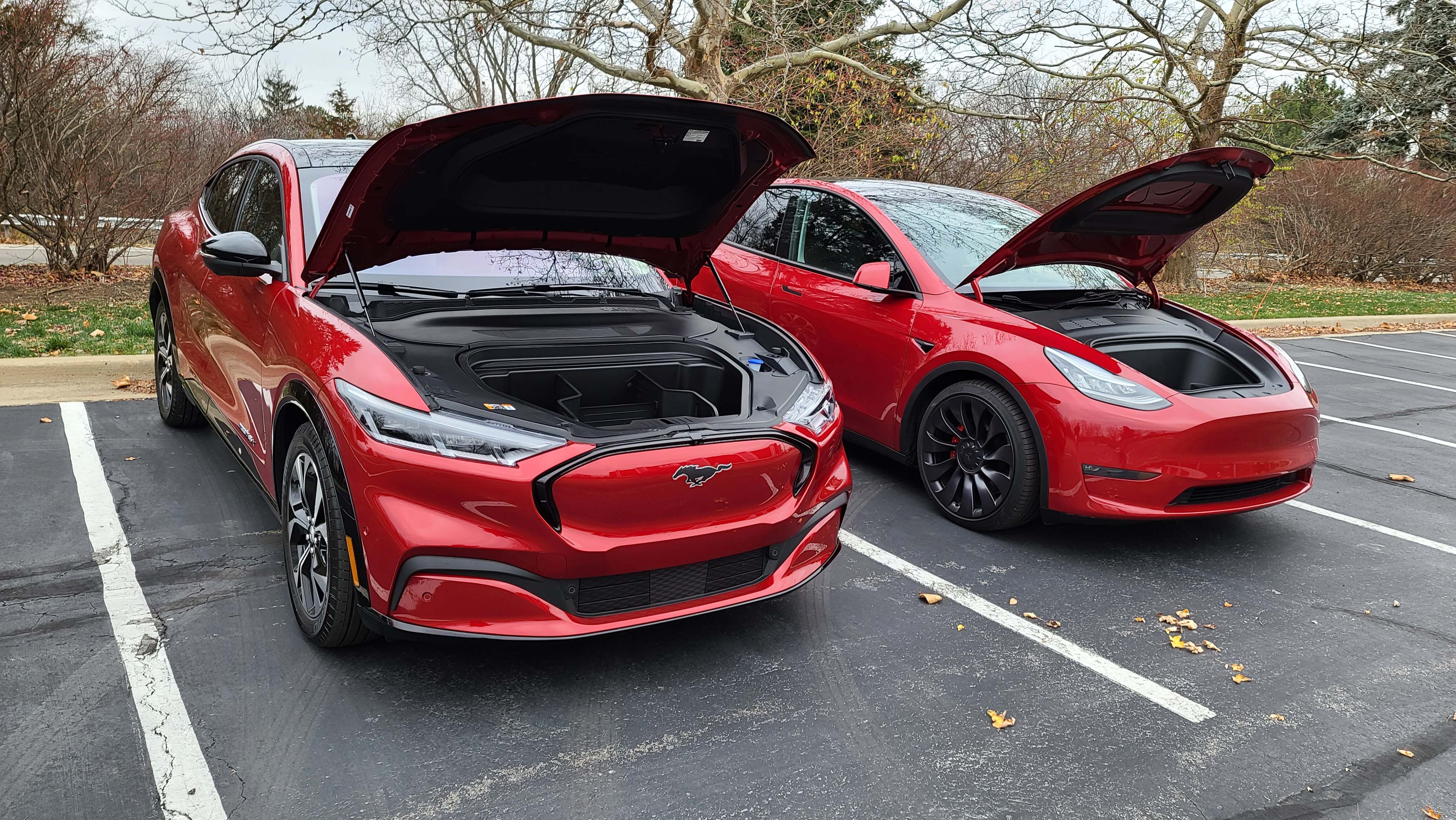 Frunk-adelic. No gas engines under the hood, the 2021 Ford Mustang Mach-E (left) and Tesla Model Y offer front cargo storage.