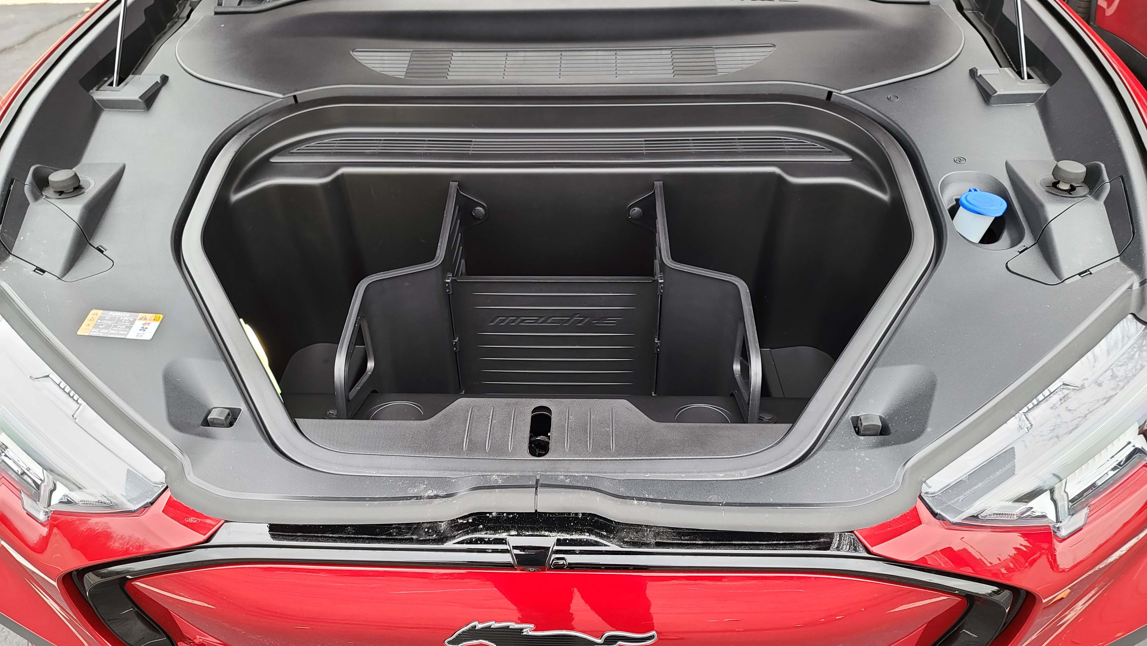 The "frunk" of the 2021 Ford Mustang Mach-E comes with storage dividers.