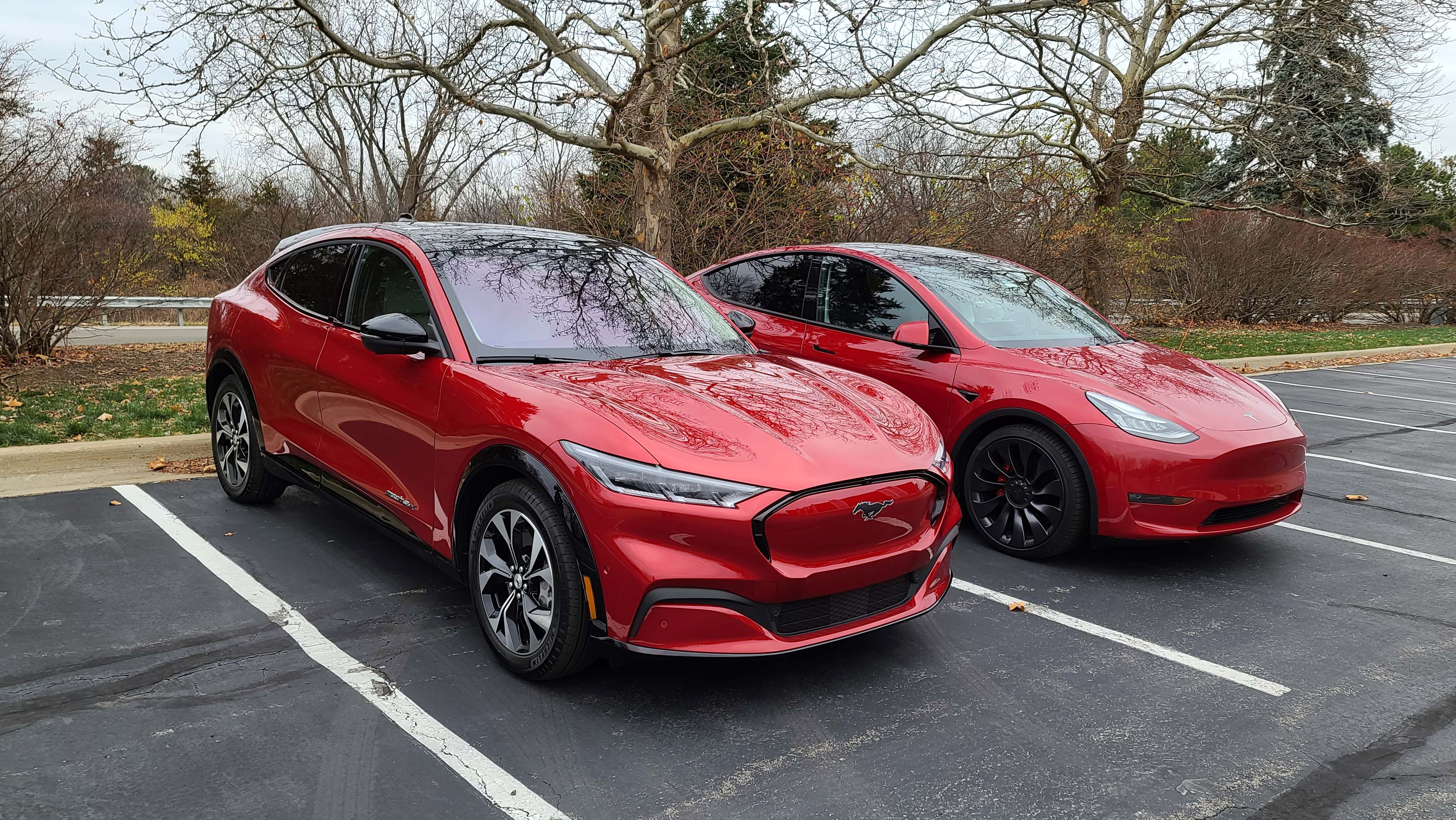The 2021 Ford Mustang Mach-E (left) tracks the Tesla Model Y spec-for-spec. 300-mile range battery, 15-inch center screen, AWD SUV, with a starting price in the high-$40,000s.