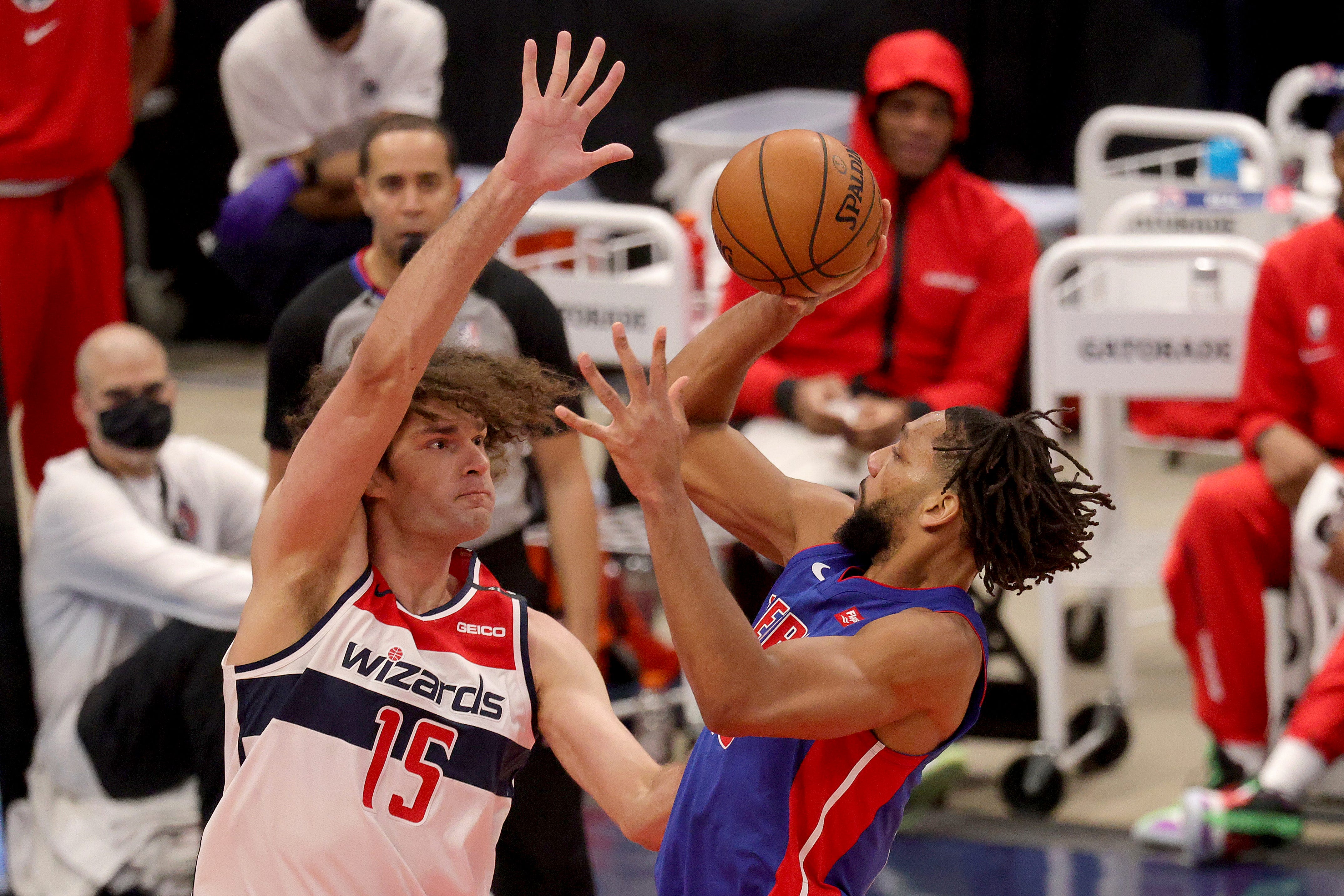 Detroit Pistons' Jahlil Okafor, right, puts up a shot over Washington Wizards Robin Lopez (15) during the second half.
