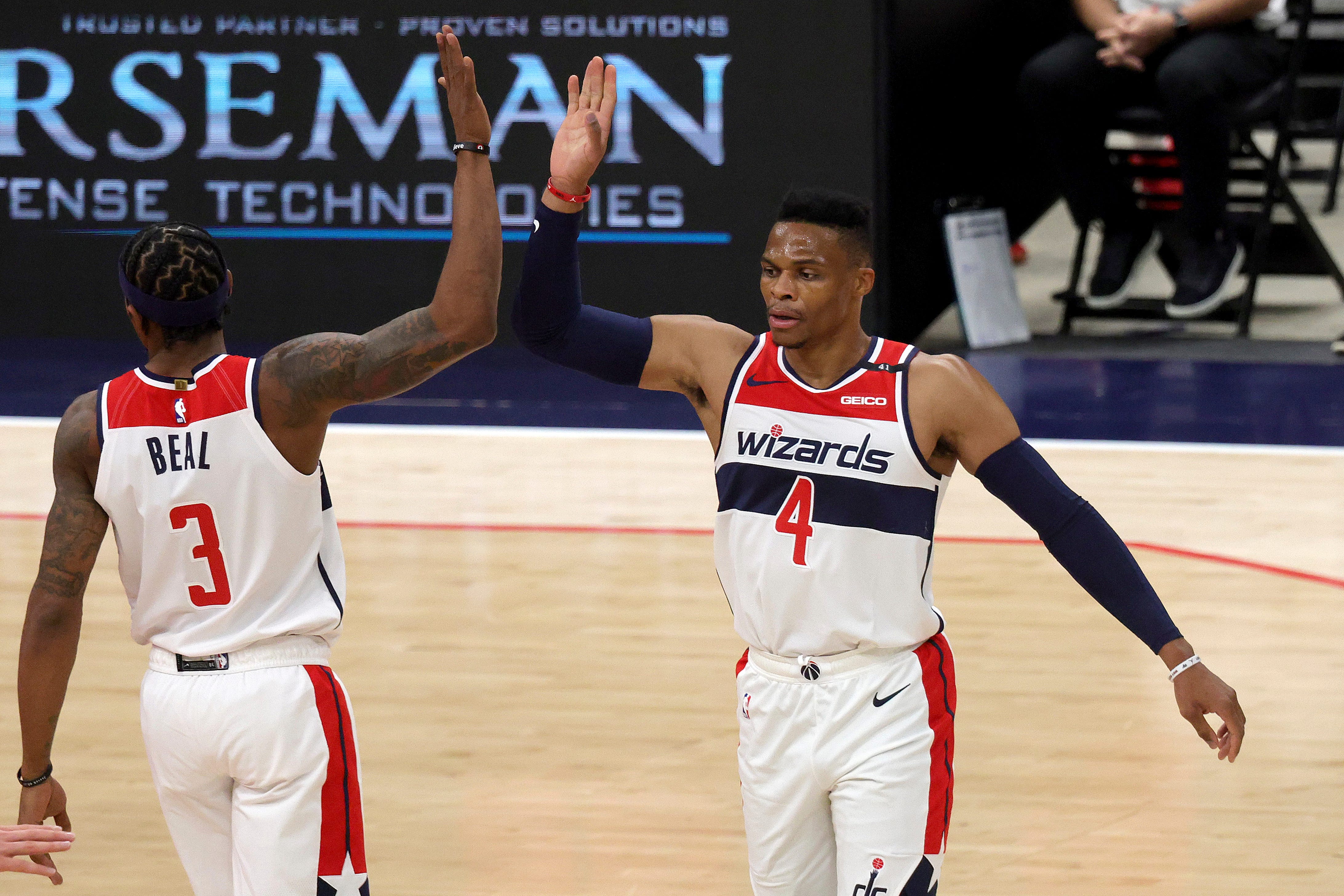 Washington Wizards Bradley Beal (3) and Russell Westbrook (4) celebrate after Beal scored and was fouled during the first half.