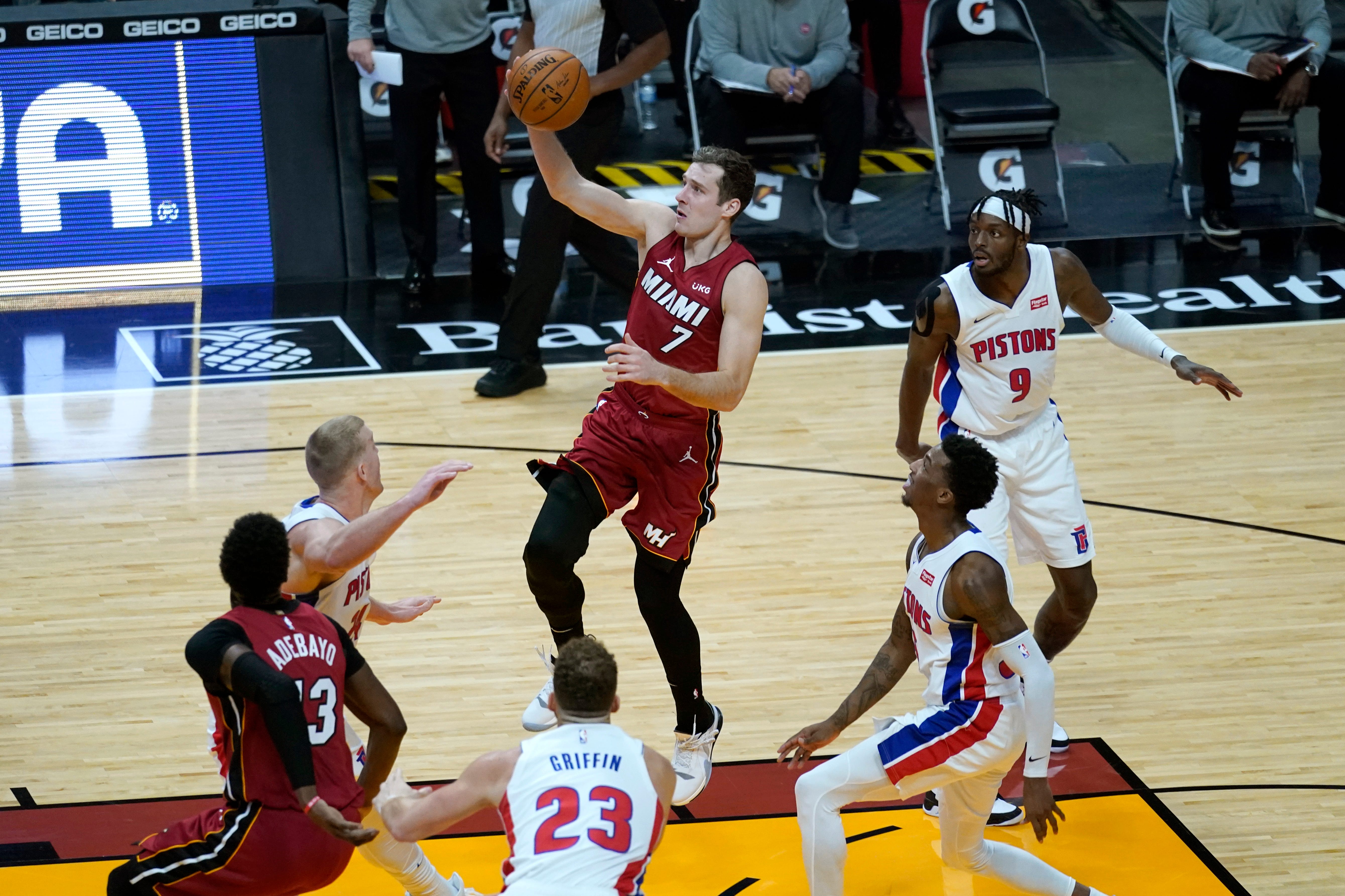 Miami Heat guard Goran Dragic (7) shoots over Detroit Pistons center Mason Plumlee, left, forward Blake Griffin (23) and forward Jerami Grant (9) during the second half.