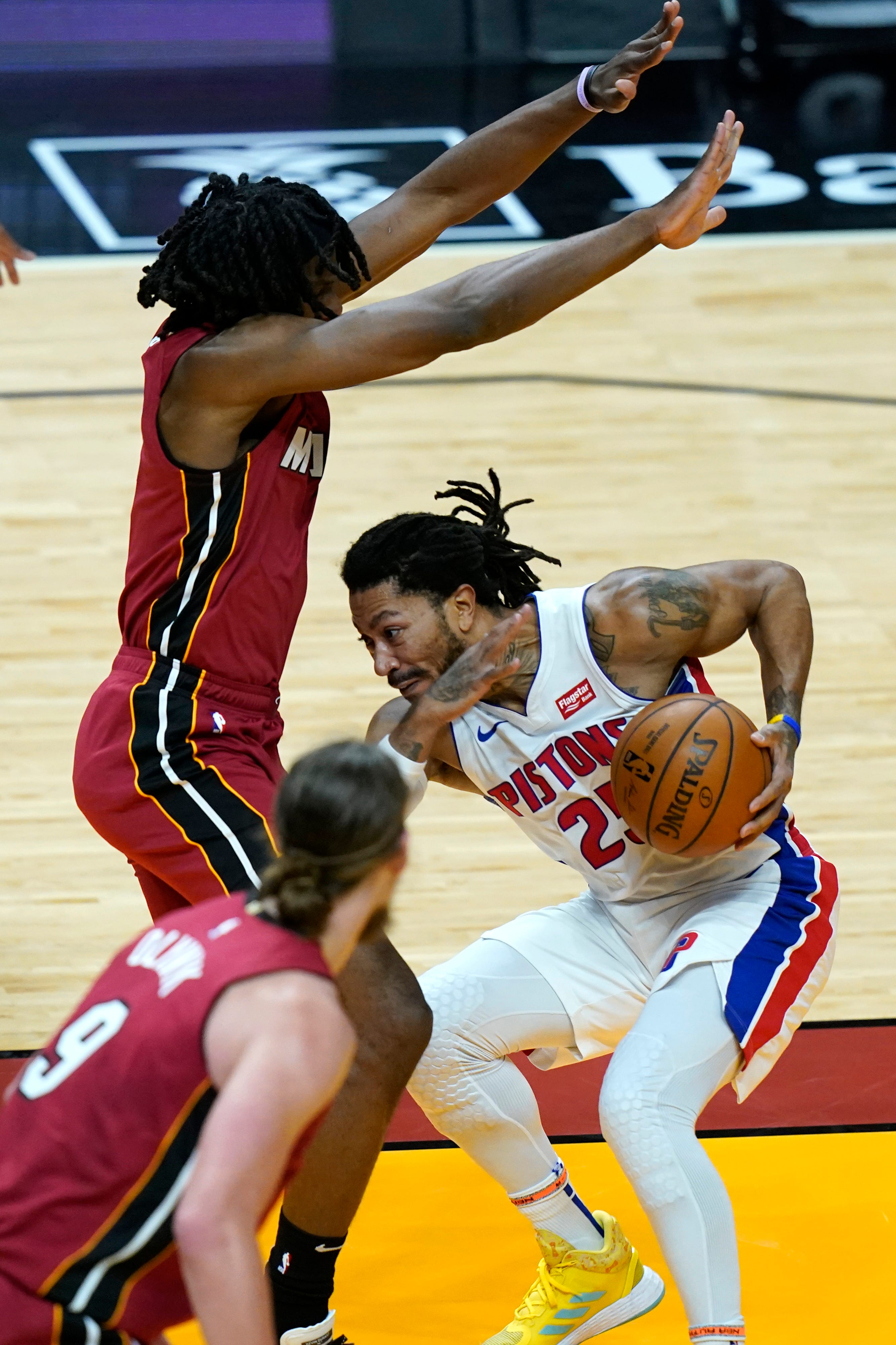 Detroit Pistons guard Derrick Rose, right, drives to the basket as Miami Heat forward KZ Okpala defends during the first half.