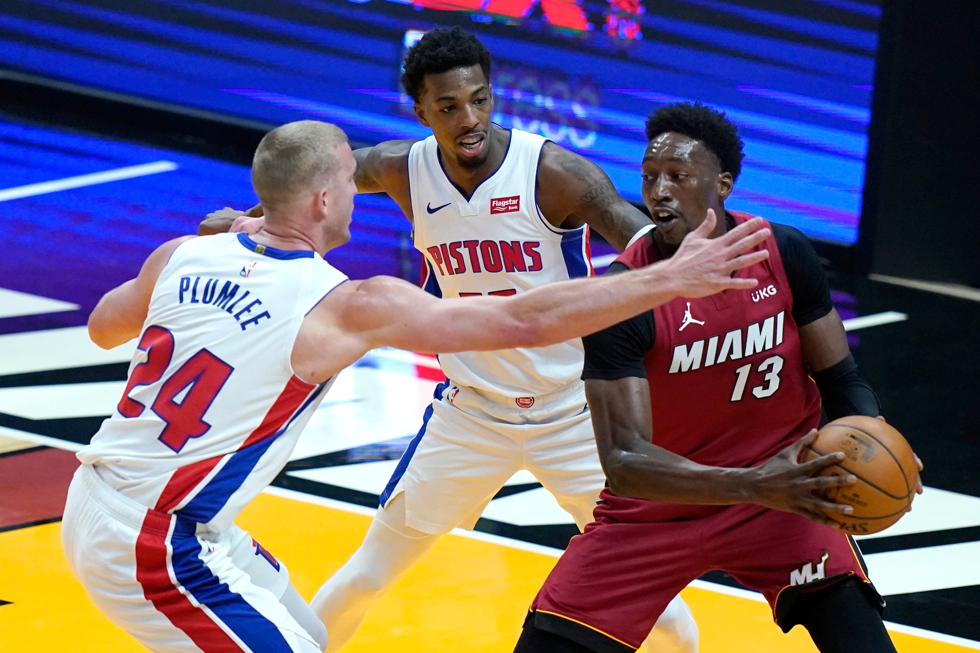 Detroit Pistons center Mason Plumlee (24) defends against Miami Heat center Bam Adebayo (13) during the first half of an NBA basketball game, Saturday, Jan. 16, 2021, in Miami.