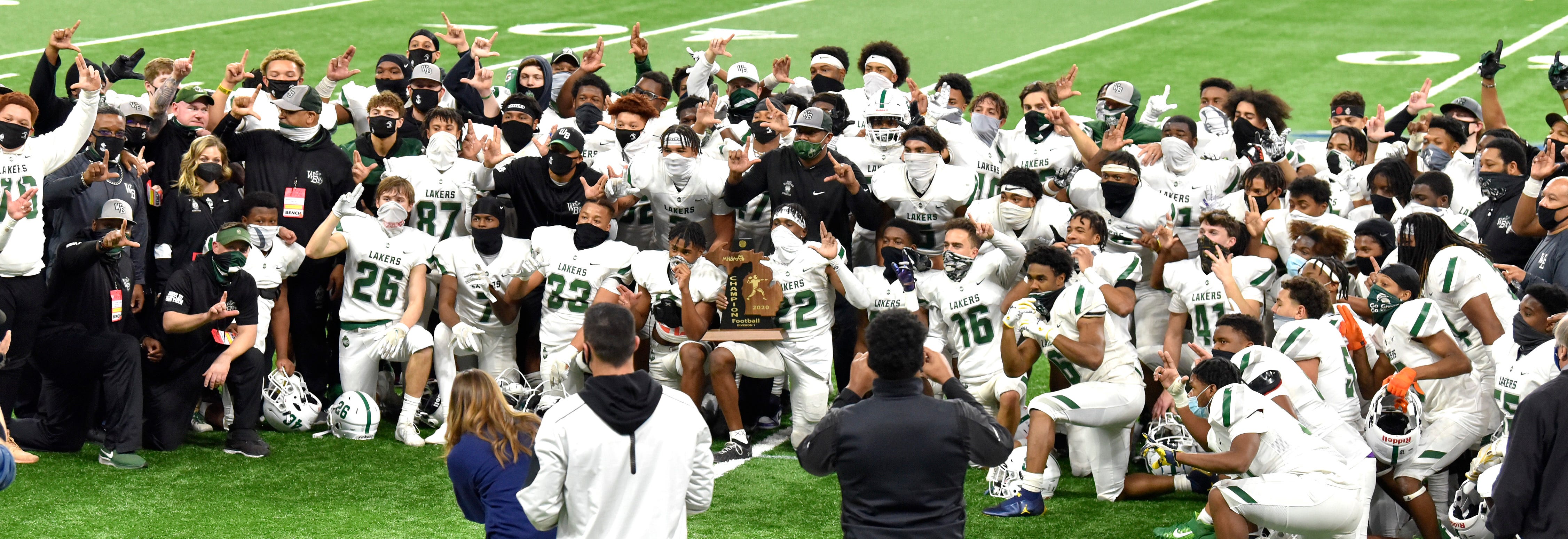 Members of the West Bloomfield football team pose for their championship group shot as they win the MHSAA Division 1 finals.