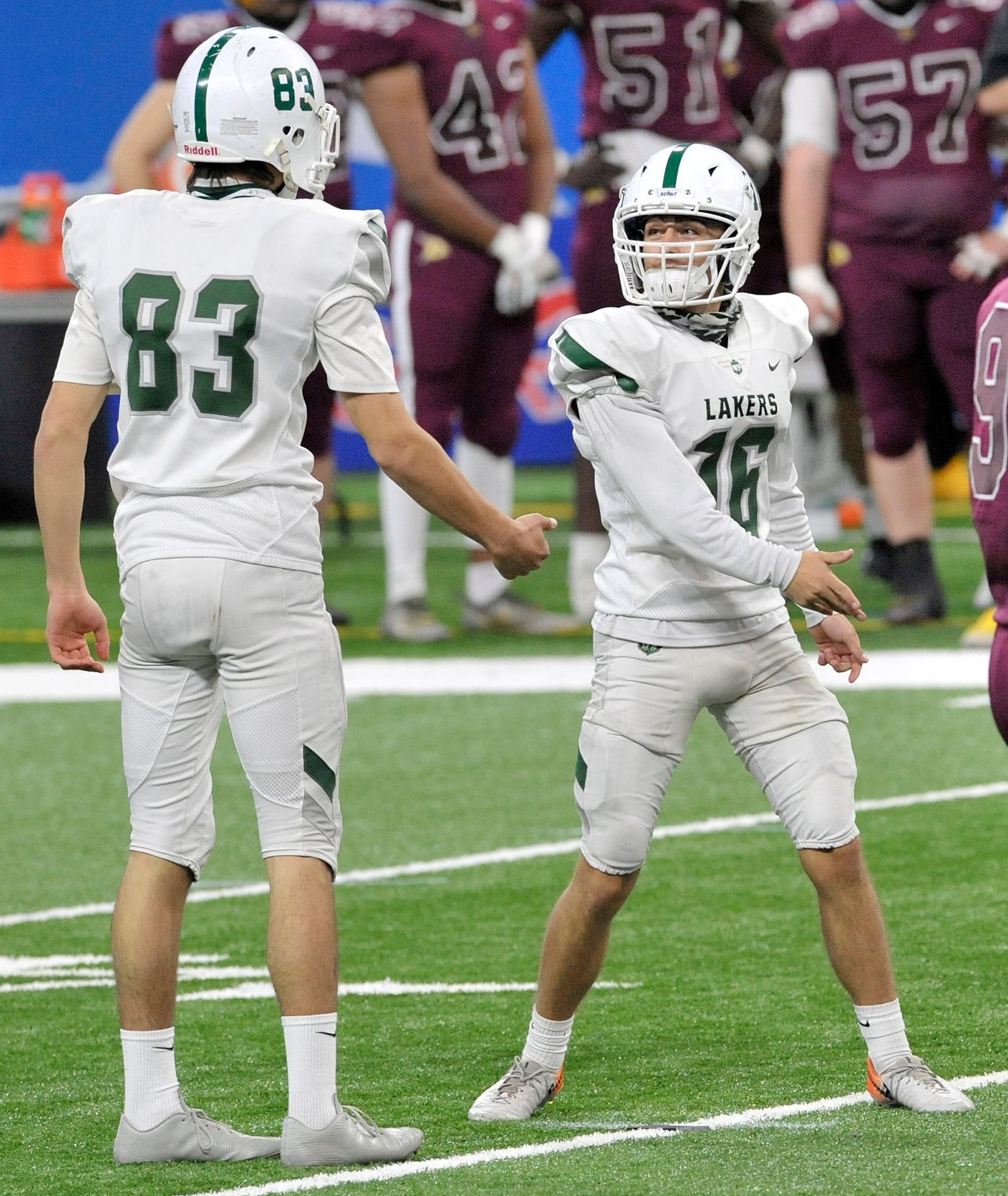 West Bloomfield's Jake Ward (16) celebrates a 45-yard field goal with holder Sammy Lafata (83) in the fourth quarter.