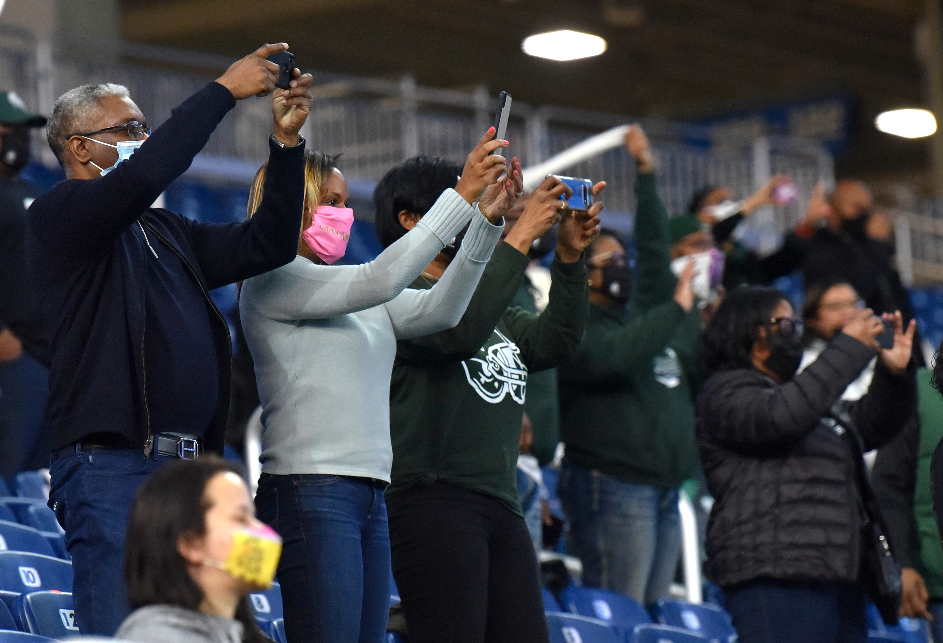 West Bloomfield fans takes pictures of their team at the end of the game.