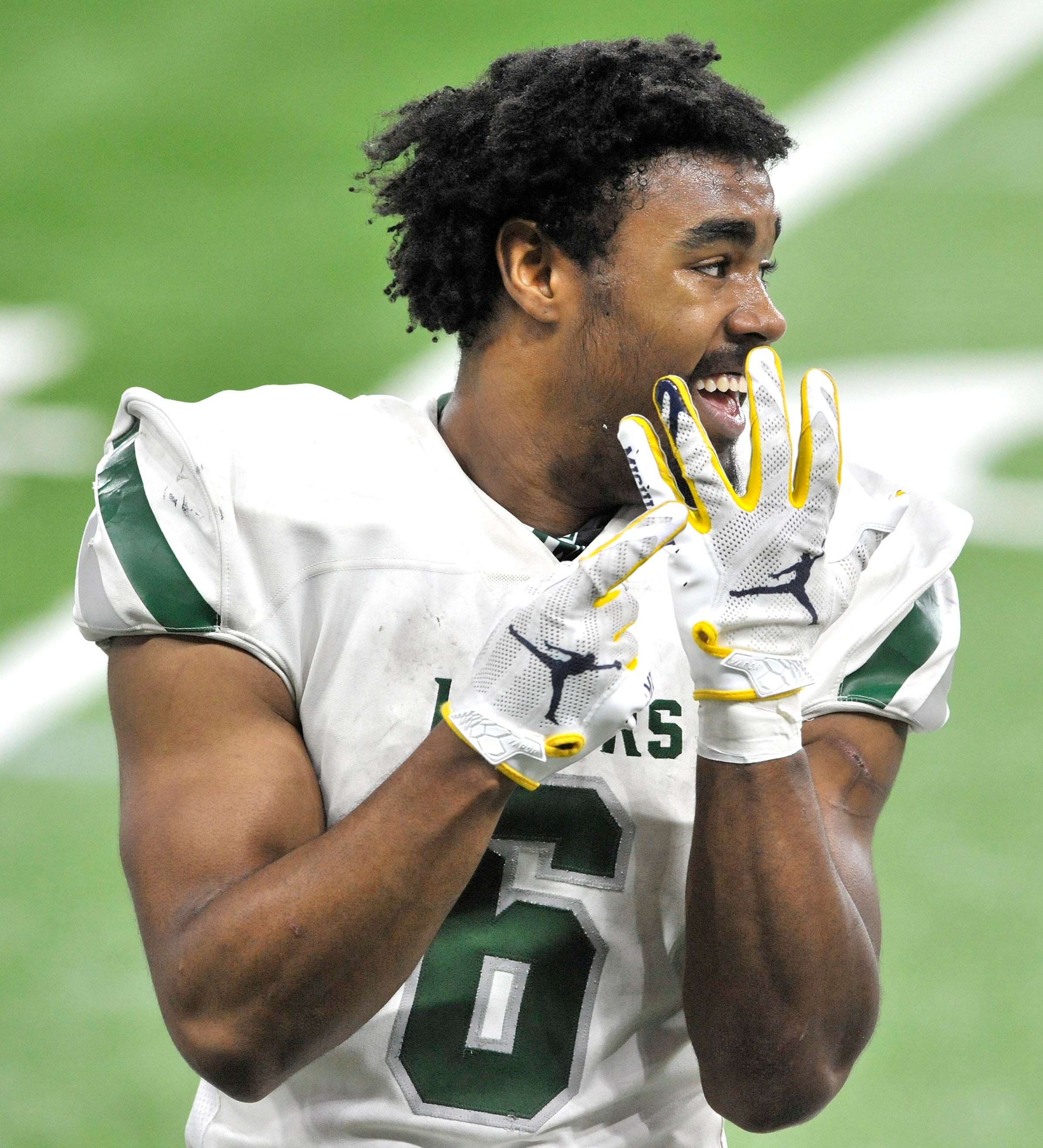 After scoring another touchdown and being taken out of the game at the end of the third quarter, West Bloomfield's Donovan Edwards (6) signals this is the finger is where he will wear his state championship ring.
