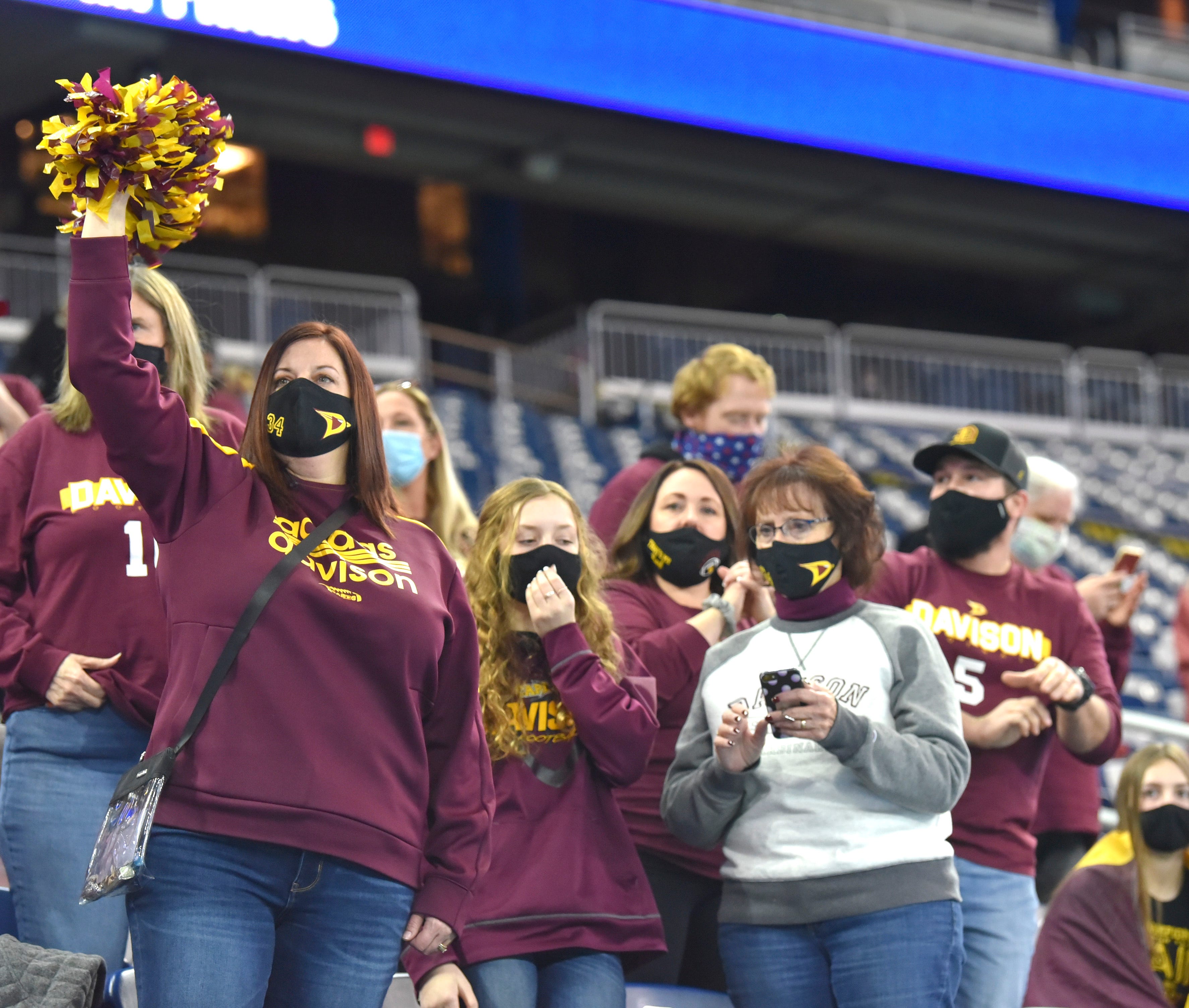 Davison fans cheer for their team at the beginning of the second half.