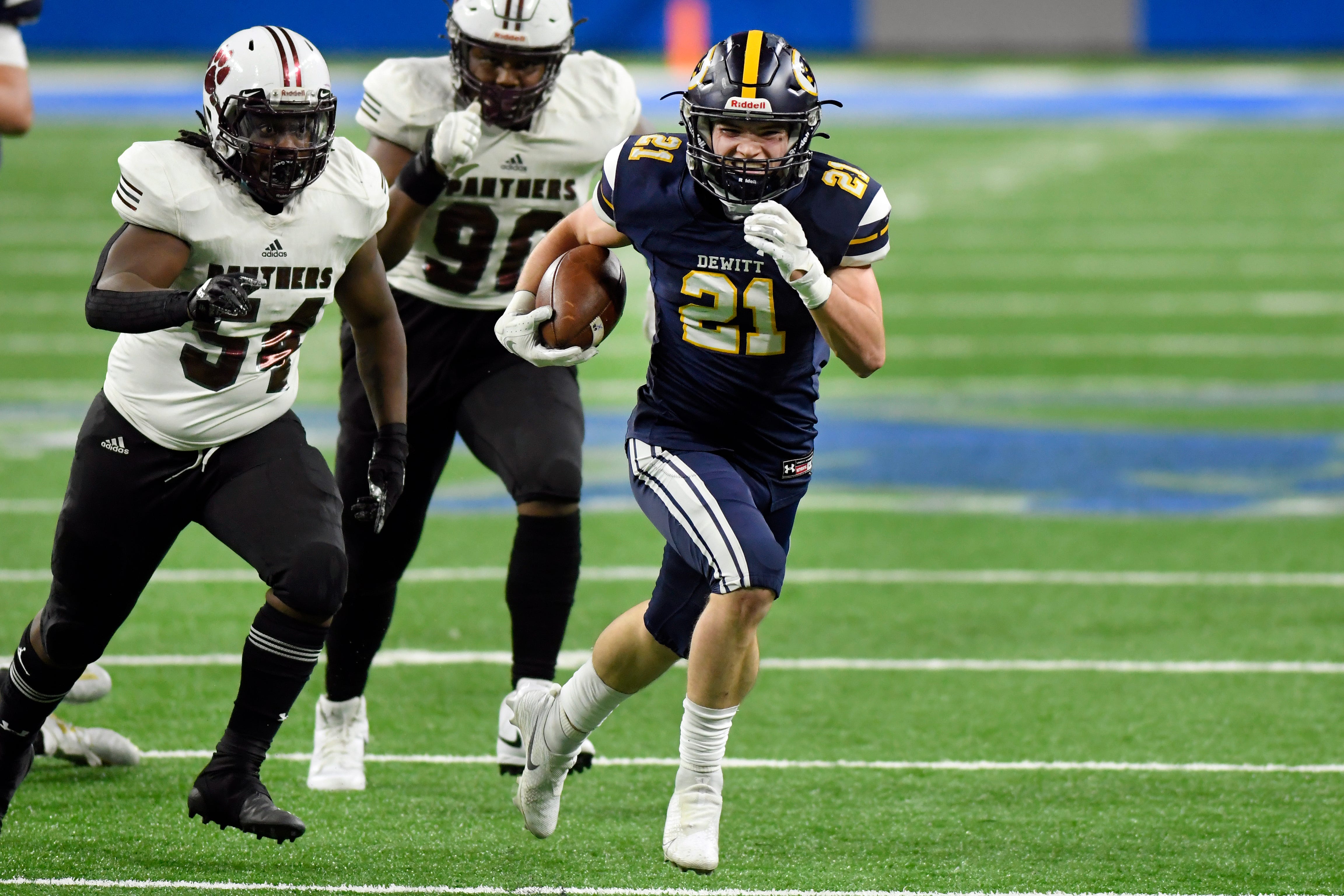 DeWitt wide receiver Bryce Debri breaks away from the River Rouge defense for a touchdown in the third quarter.