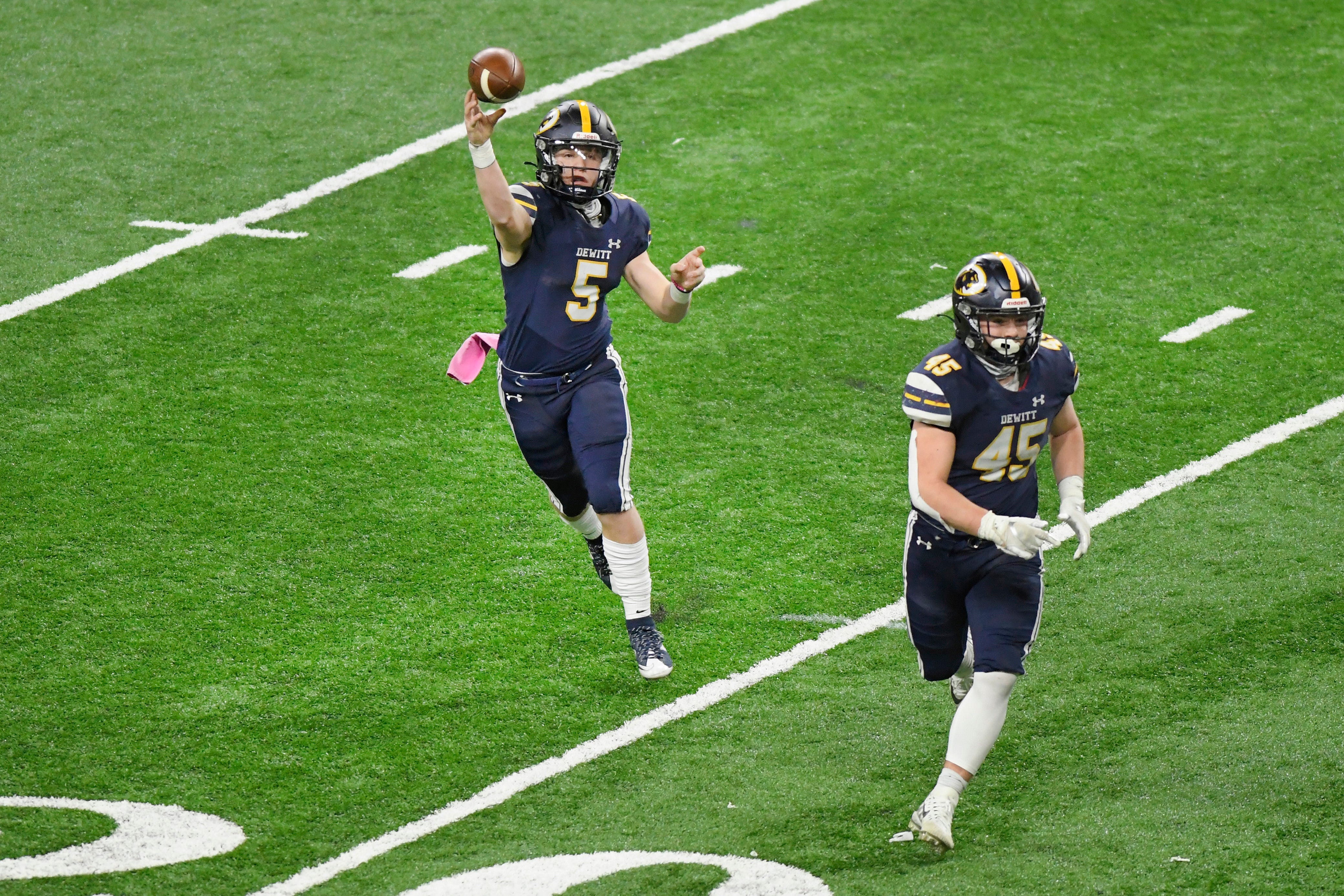 DeWitt quarterback Tyler Holtz passes against River Rouge in the second quarter of a Division 3 football final held at Ford Field.