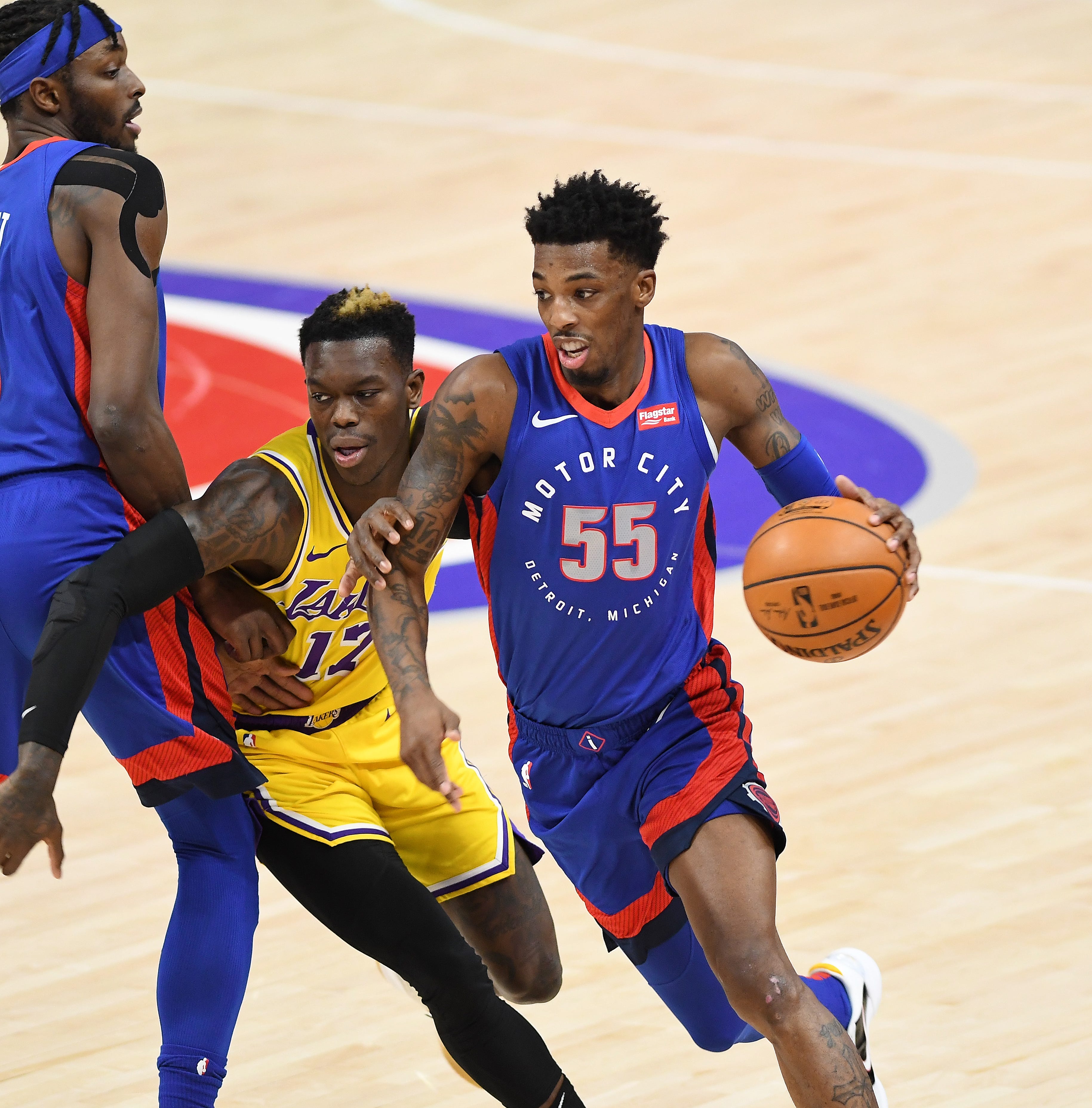 Pistons' Delon Wright drives around Lakers' Dennis Schroder in the second quarter.
