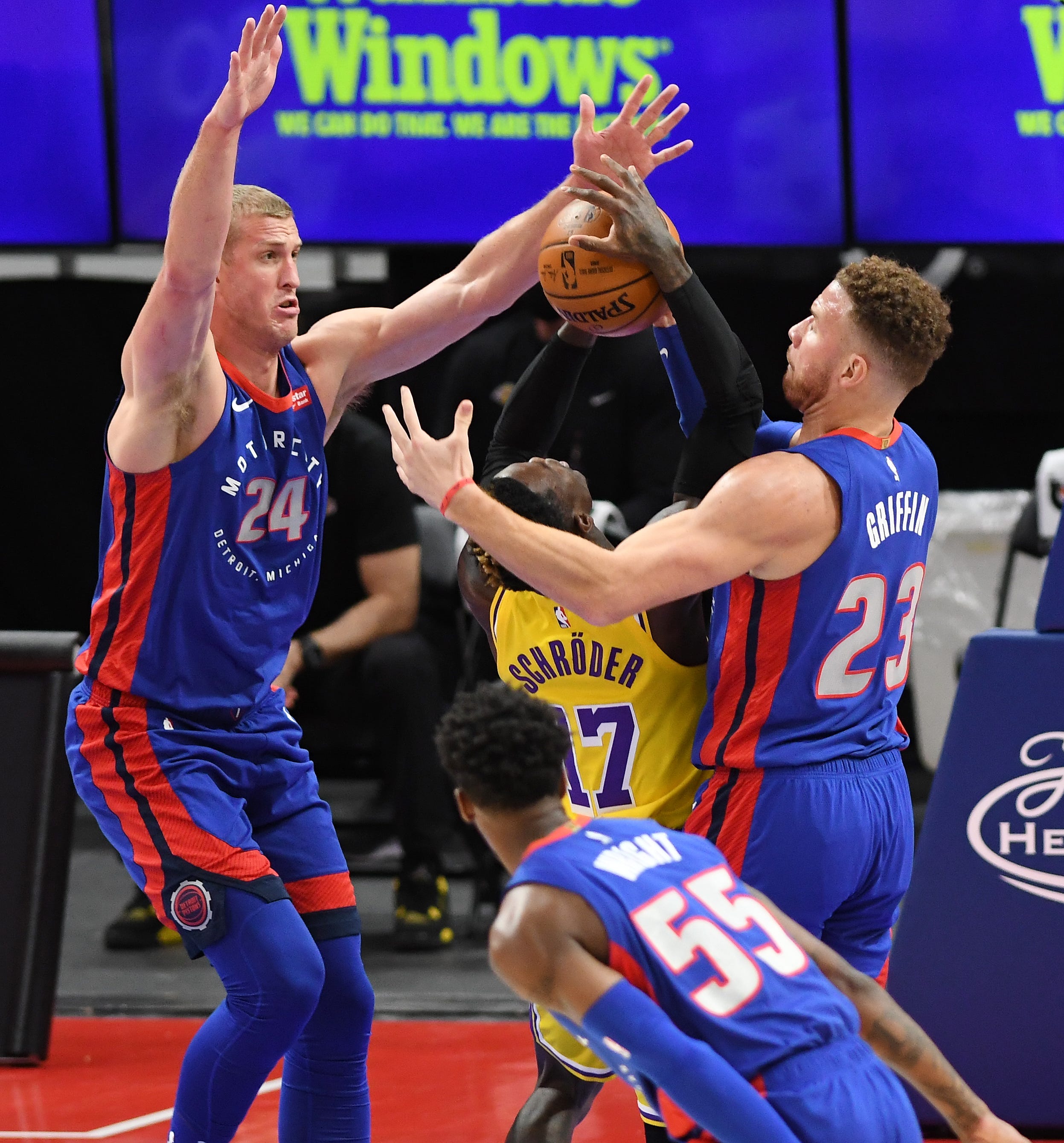 Pistons Mason Plumlee, left; and Blake Griffin defends Lakers' Dennis Schroder in the first quarter.