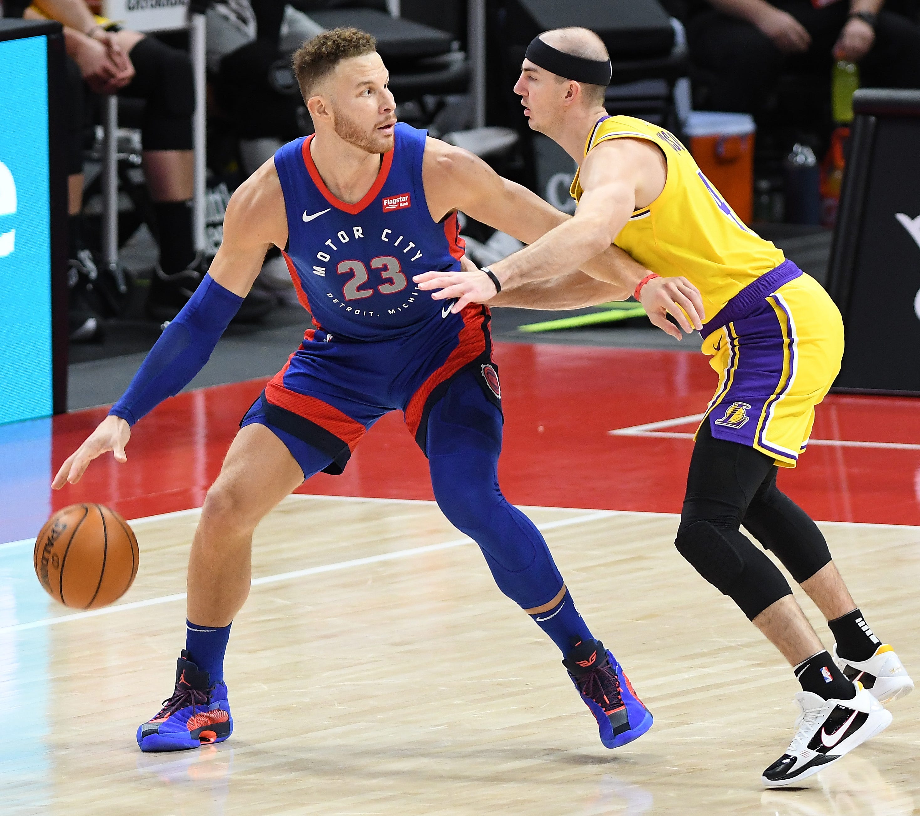 Pistons' Blake Griffin looks for room around Lakers' Alex Caruso in the third quarter.