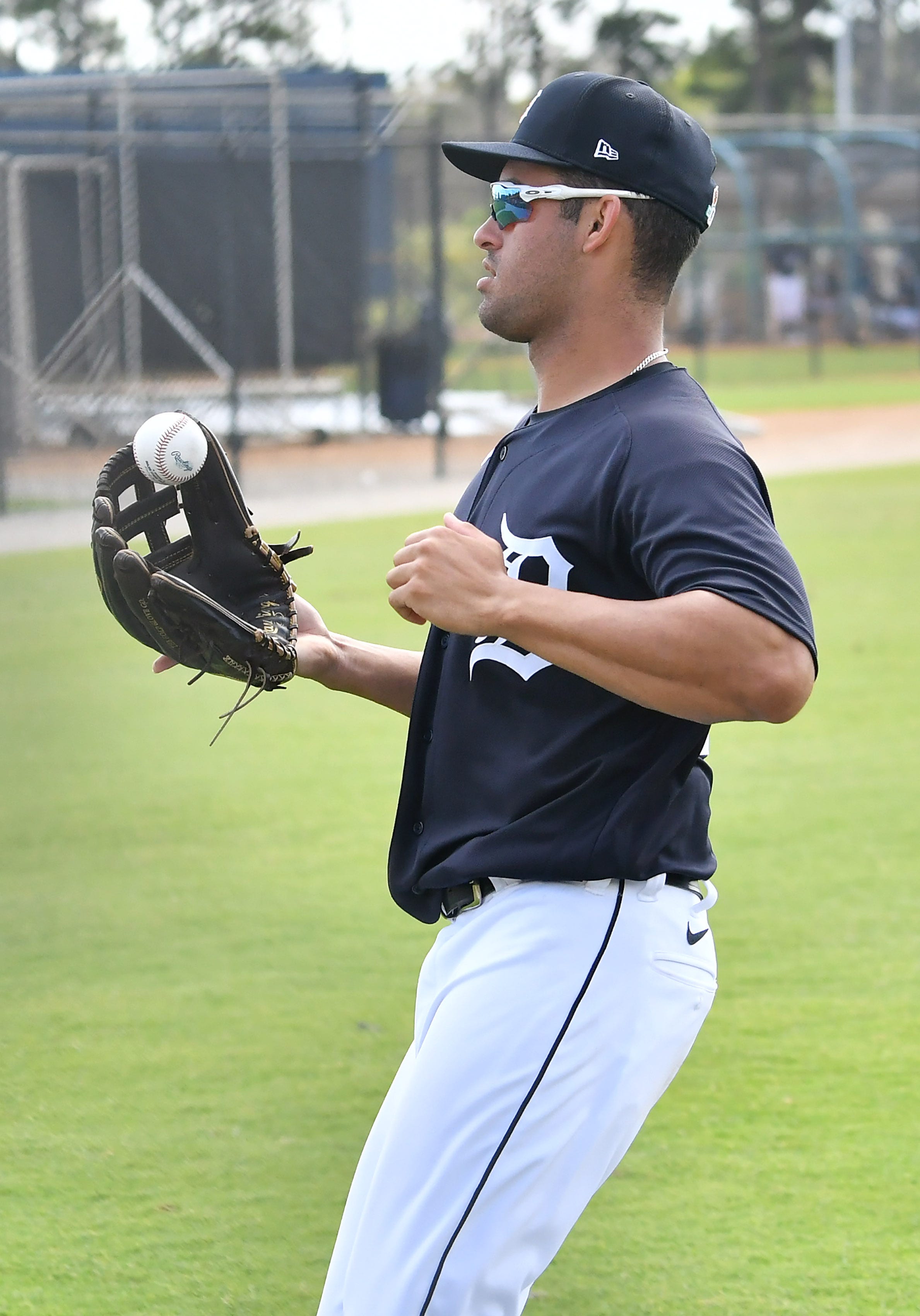 Tigers prospect Riley Greene prepares to throw the ball back in at the team's workout.