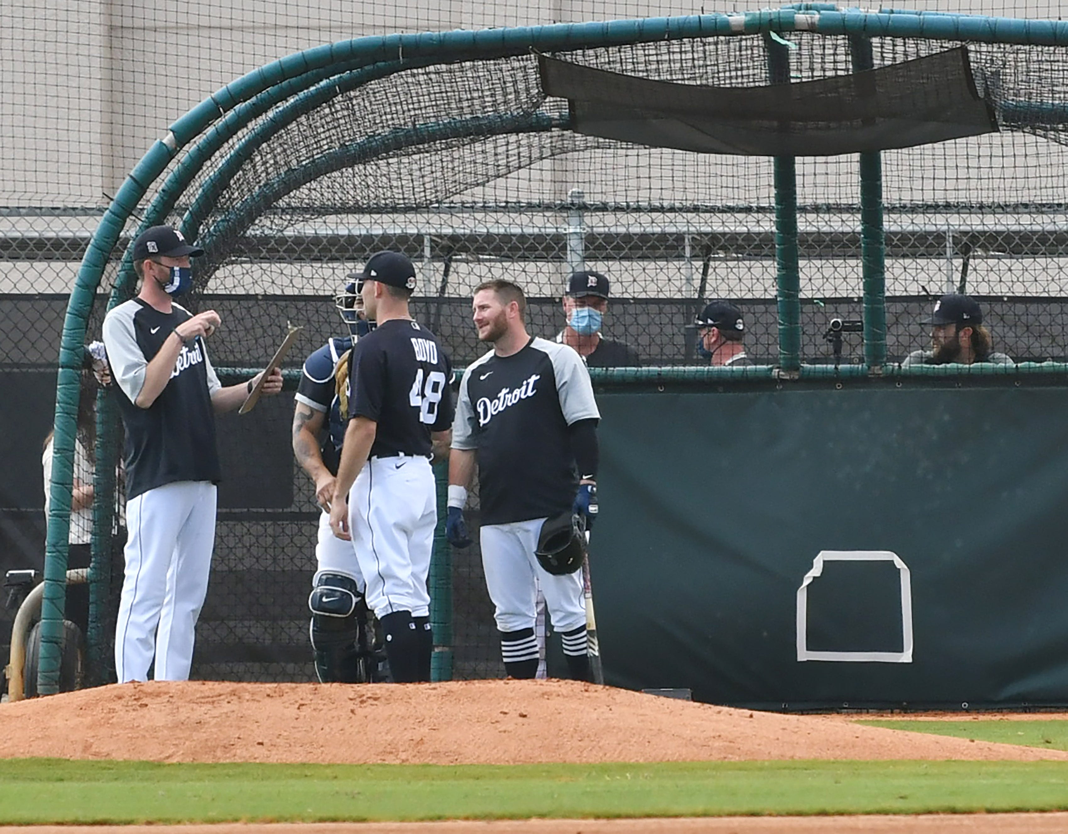 From left, Tigers pitching coach Chris Fetter talks with pitcher Matthew Boyd (48) after Boyd threw live batting practice.