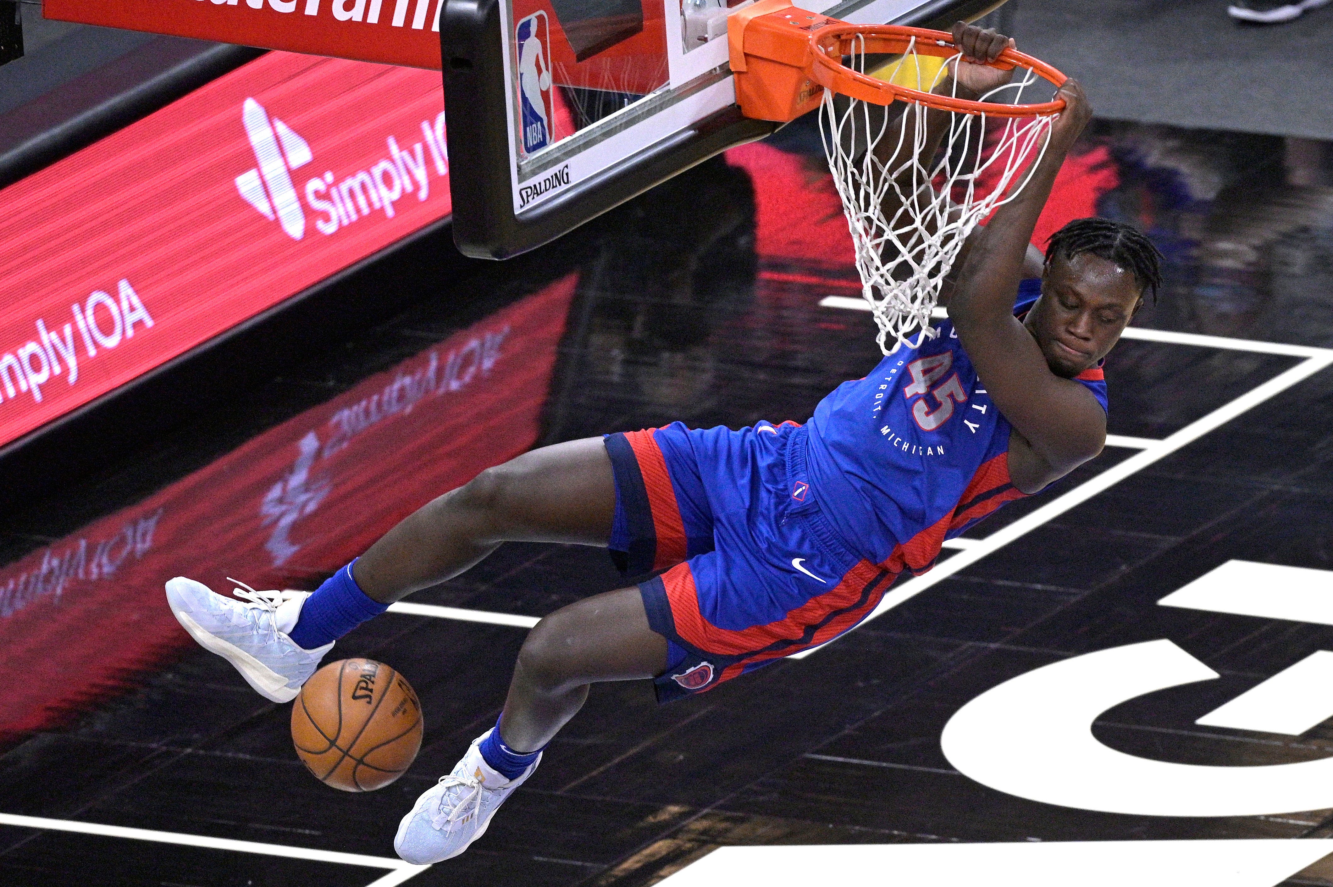 Detroit Pistons forward Sekou Doumbouya (45) dunks the ball during the second half of an NBA basketball game against the Orlando Magic, Tuesday, Feb. 23, 2021.