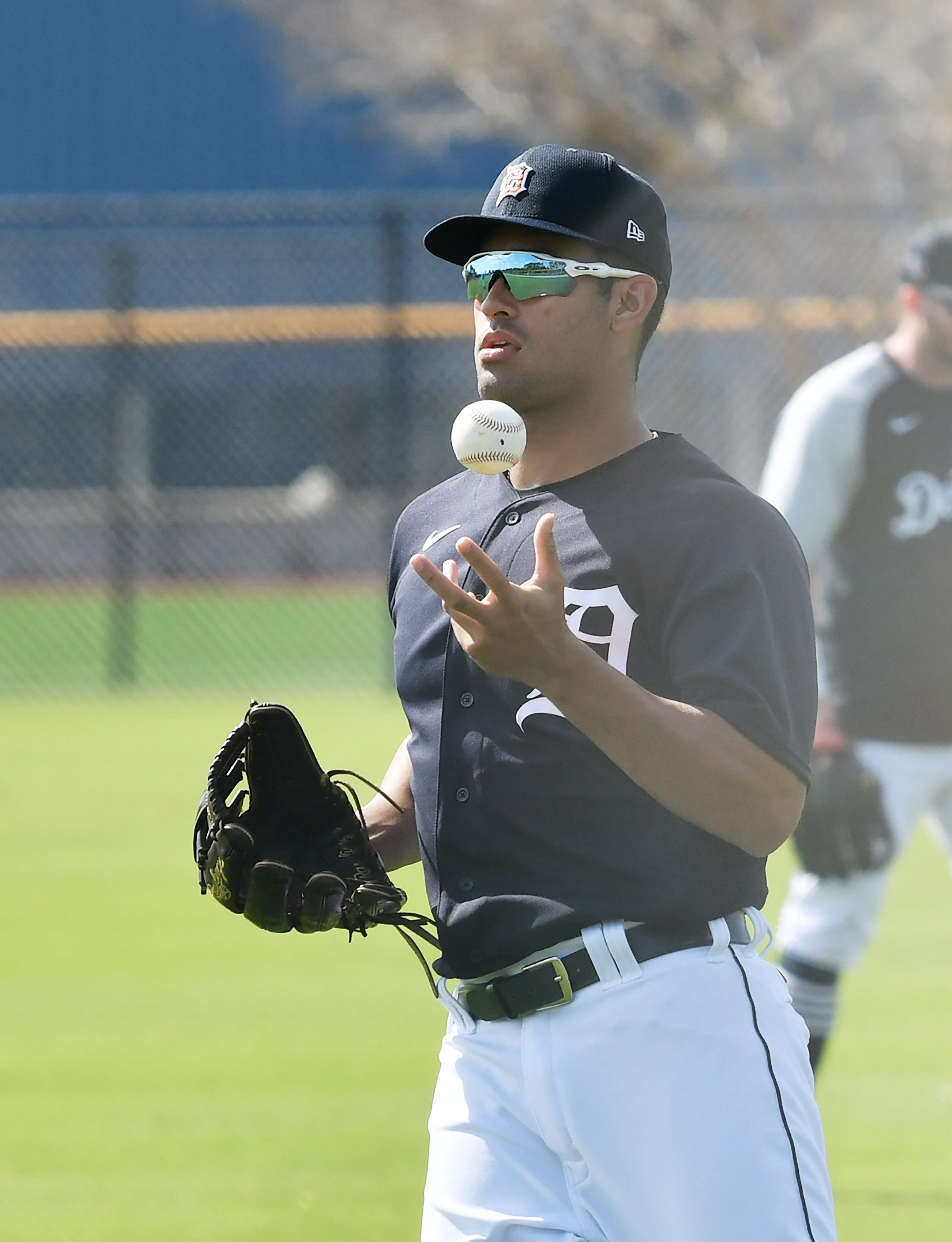 Tigers prospect Riley Greene prepares to throw the ball back in at the team's workout.