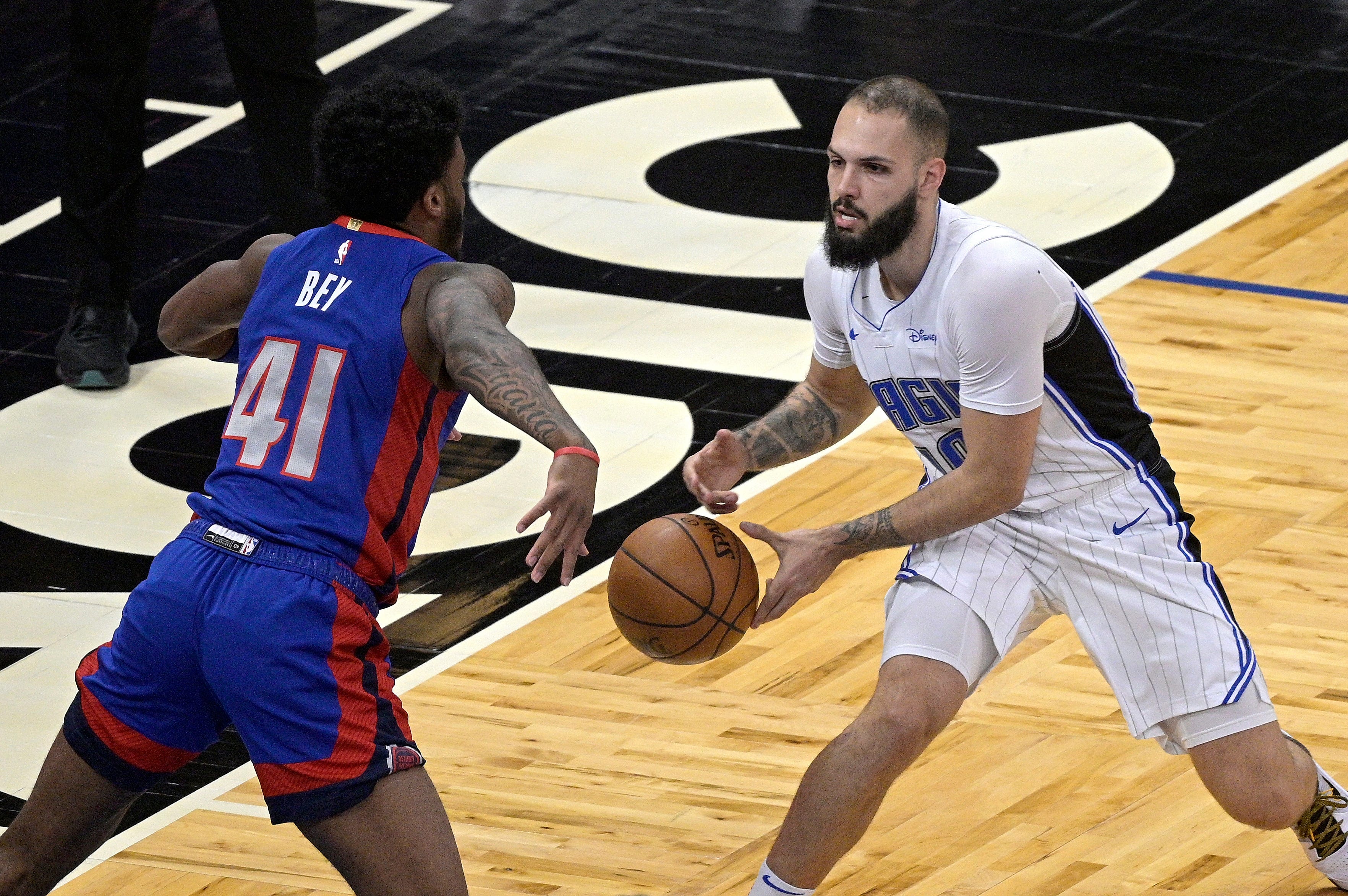 Orlando Magic guard Evan Fournier (10) loses control of the ball to Detroit Pistons forward Saddiq Bey (41) during the first half of an NBA basketball game.