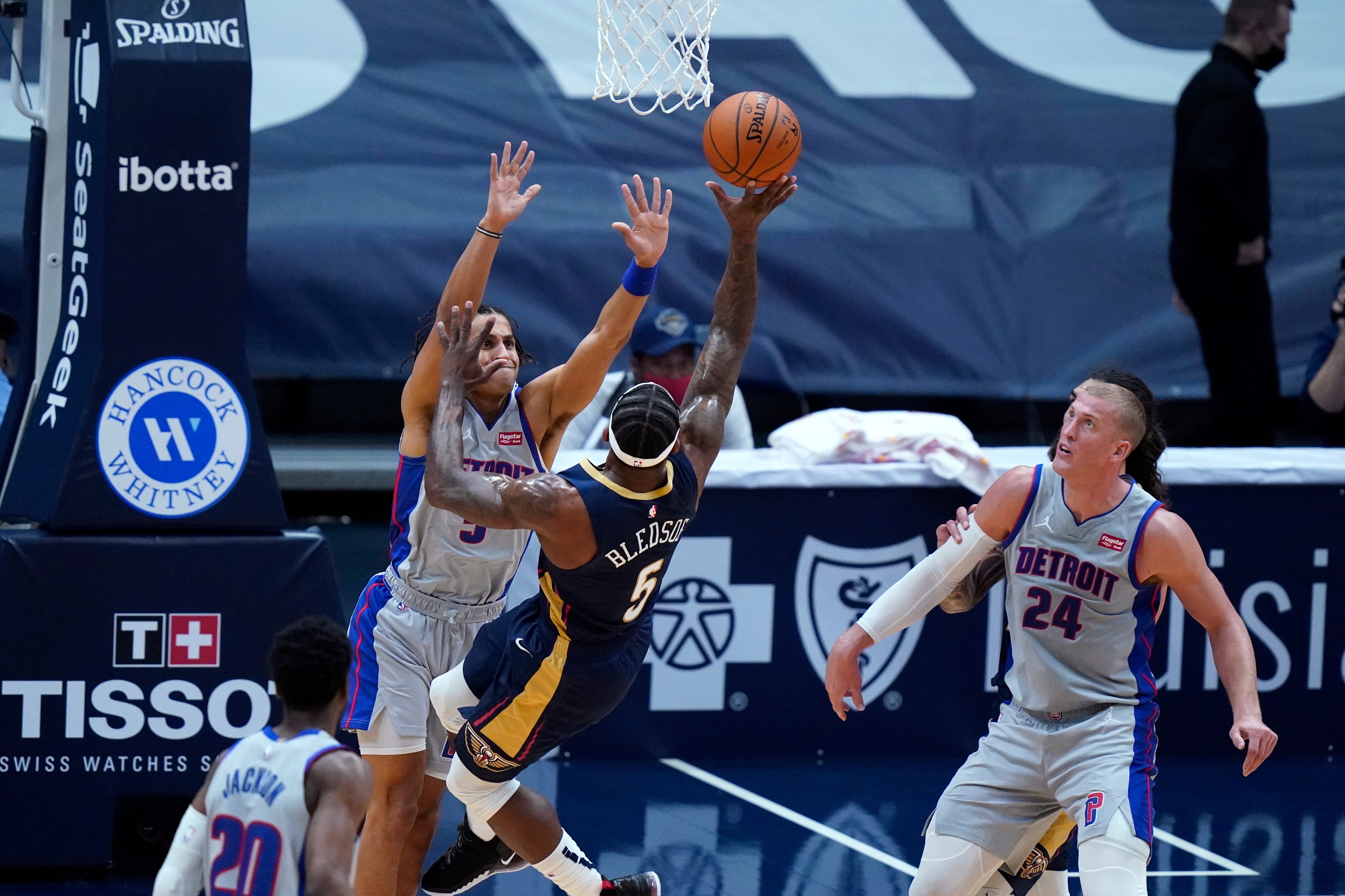 New Orleans Pelicans guard Eric Bledsoe shoots against Detroit Pistons guard Frank Jackson, top left, during the first half of an NBA basketball game in New Orleans, Wednesday, Feb. 24, 2021.