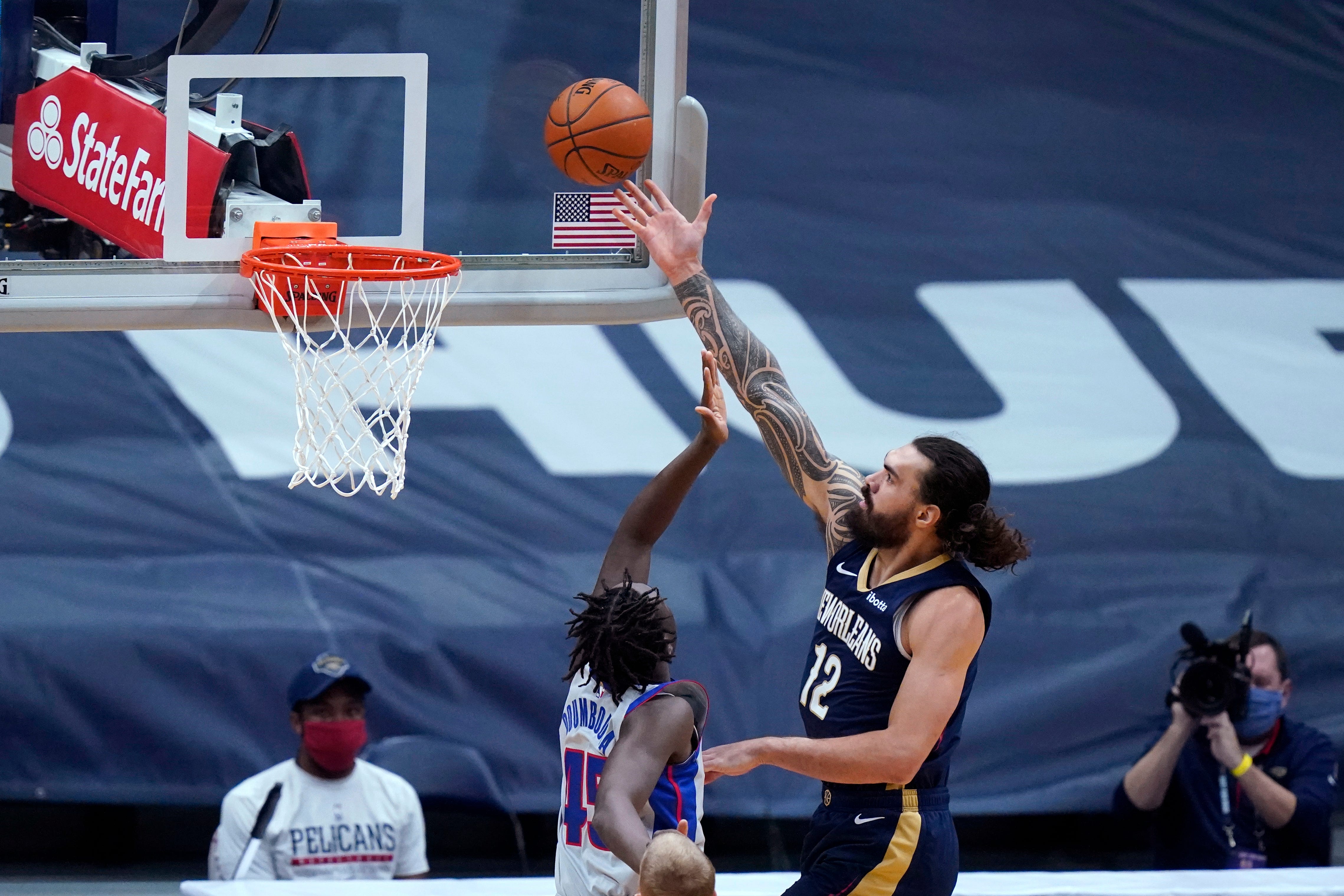 New Orleans Pelicans center Steven Adams (12) goes to the basket against Detroit Pistons forward Sekou Doumbouya (45) during the first half of an NBA basketball game in New Orleans, Wednesday, Feb. 24, 2021.