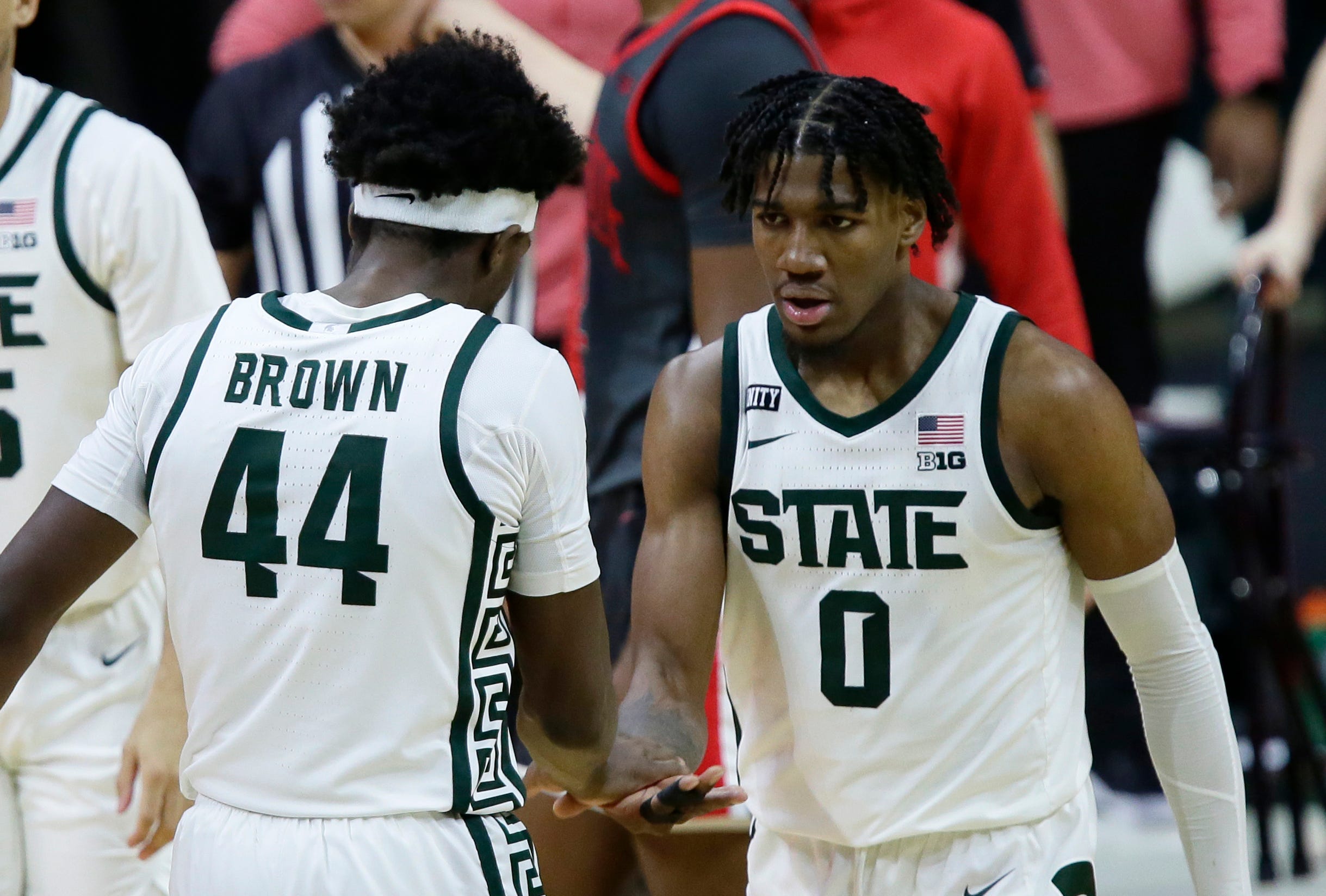 Michigan State forward Aaron Henry (0) celebrates with forward Gabe Brown (44) after scoring against Ohio State during the second half.