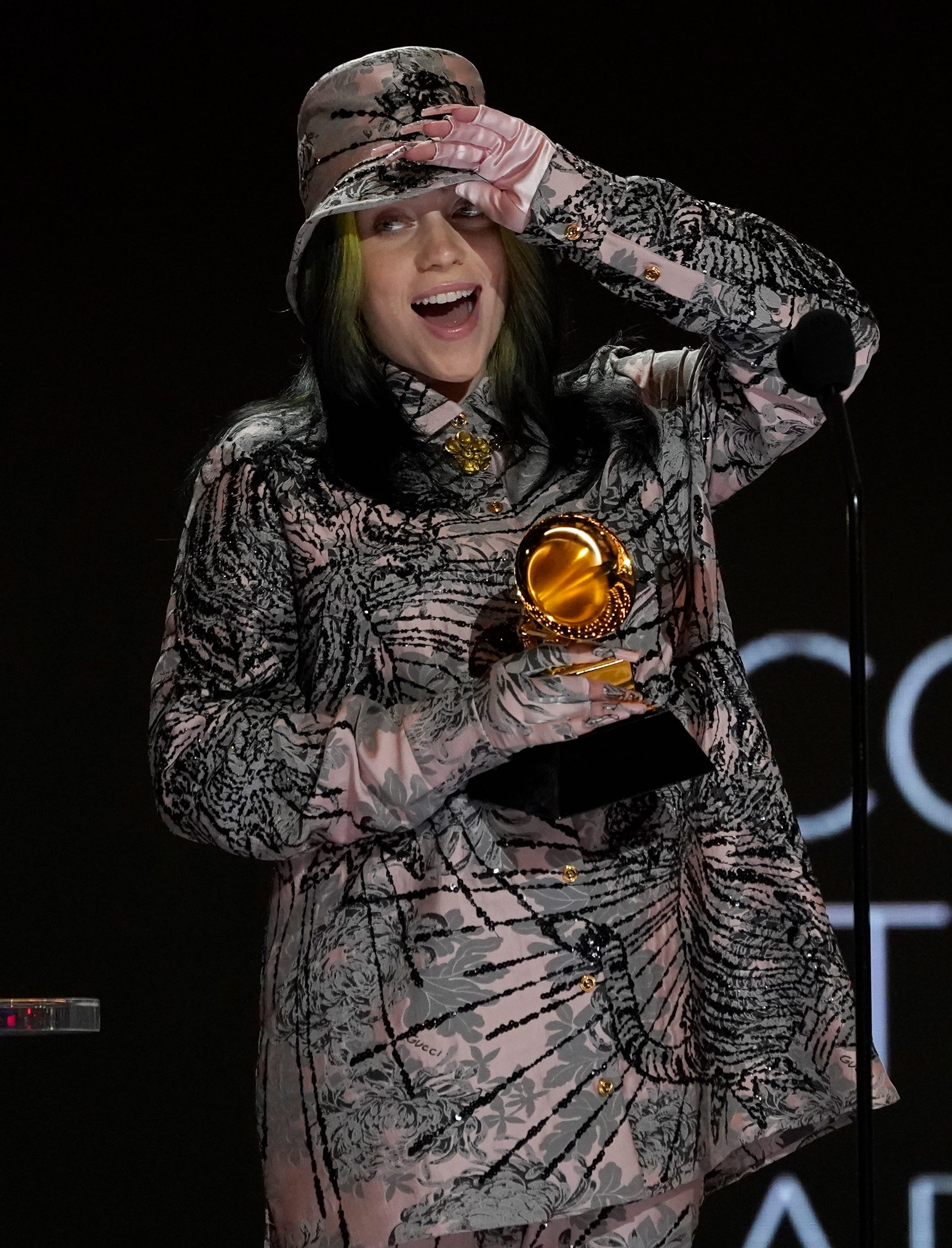 Billie Eilish reacts as she accepts the award for record of the year for "Everything I Wanted" at the 63rd annual Grammy Awards at the Los Angeles Convention Center on Sunday, March 14, 2021.