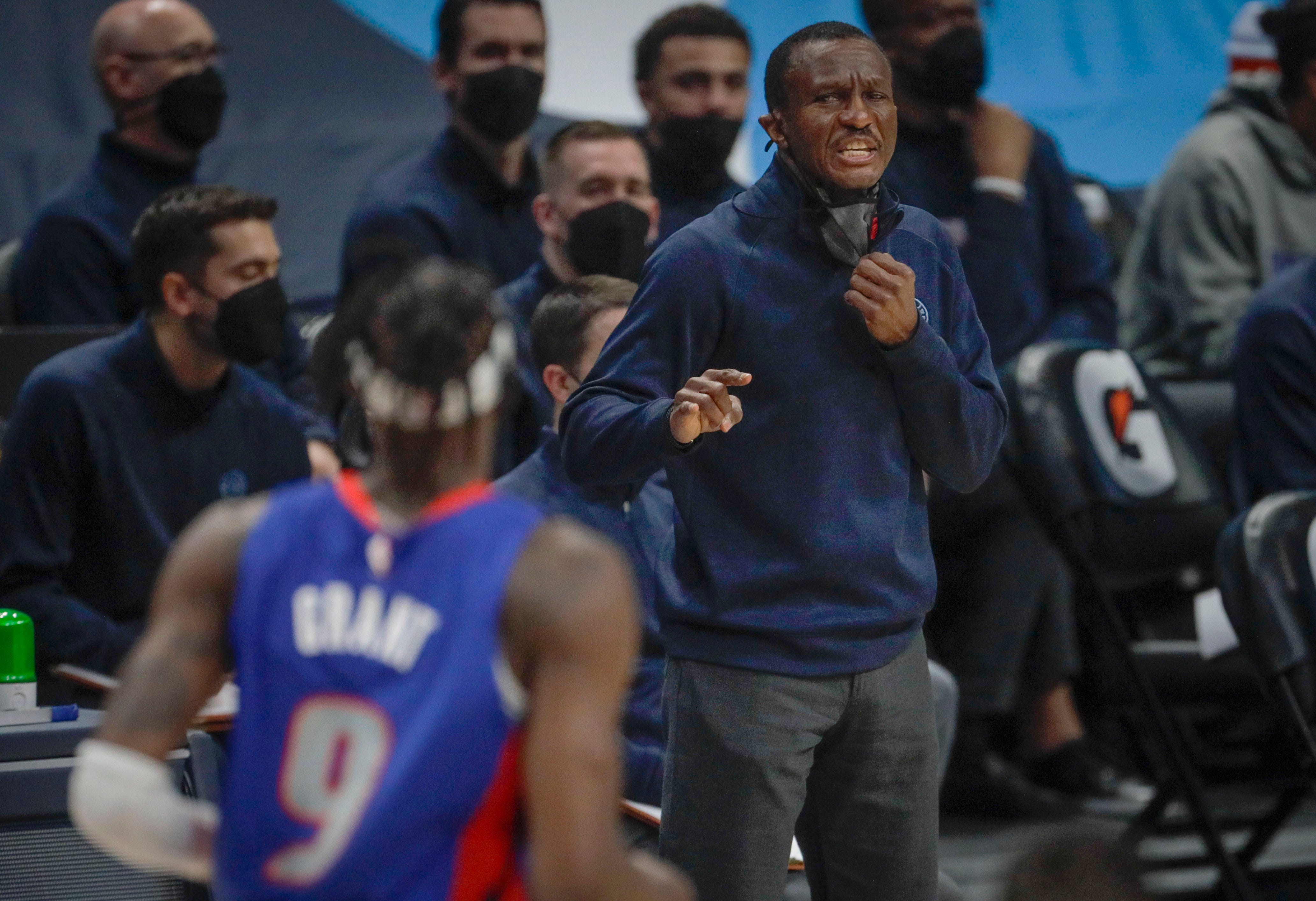 Detroit Pistons coach Dwane Casey shouts to Pistons forward Jerami Grant (9) in the second quarter of an NBA basketball game against the Denver Nuggets in Denver, Tuesday, April 6, 2021.