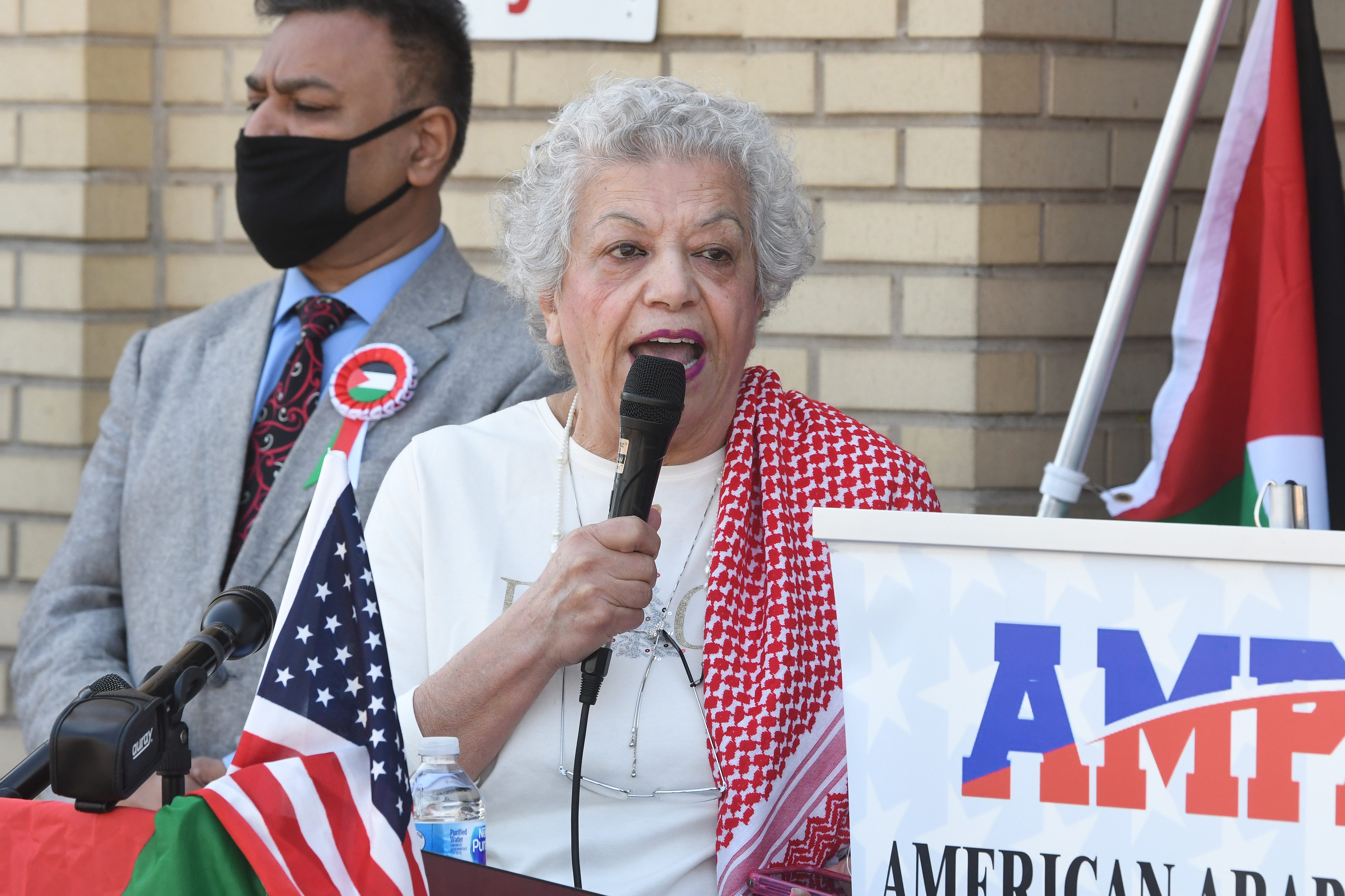 Nada Dalgamouni, global education director of the International Institute of Metropolitan Detroit, Inc. speaks during a press conference at the AMS Mosque in Dearborn.