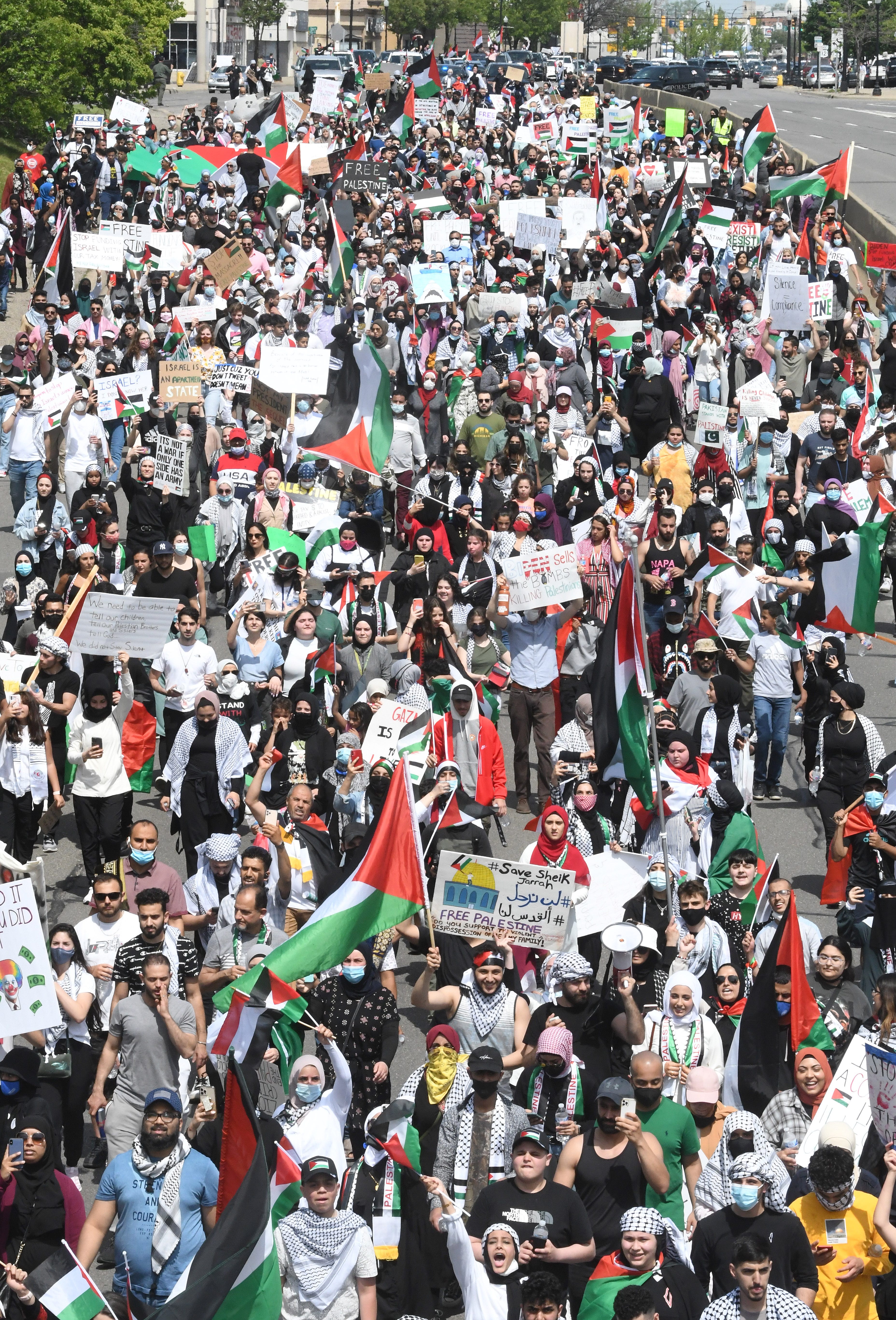 Thousands of Palestinian supporters march along Michigan Avenue in Dearborn while President Joe Biden visits a Ford electric vehicle factory nearby. The protestors were calling for Biden to pressure Israel to stop bombing Palestinians in Gaza.