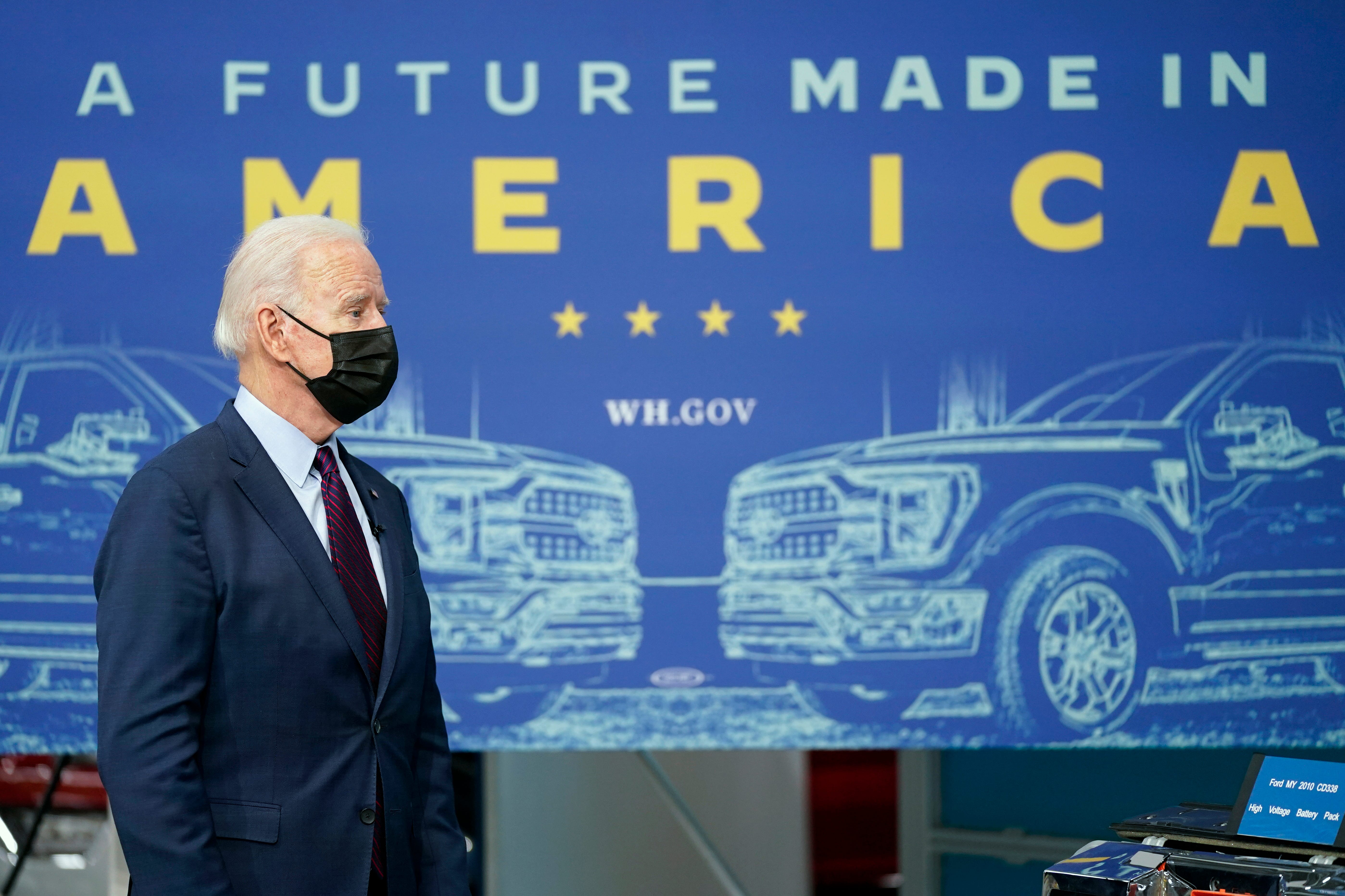 President Joe Biden listens during a tour of the Ford Rouge EV Center, Tuesday, in Dearborn.