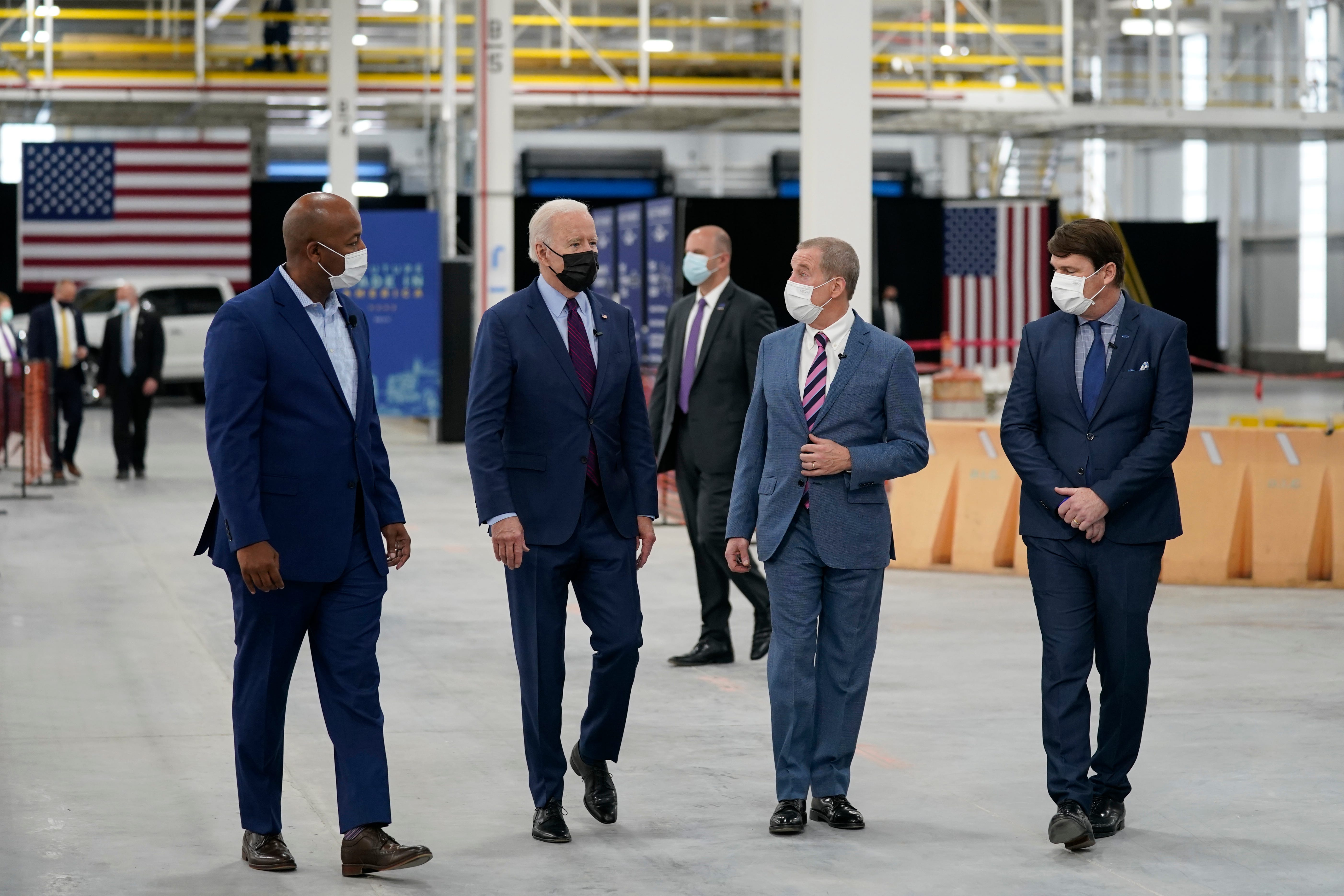 President Joe Biden tours the Ford Rouge EV Center, Tuesday, May 18, 2021, in Dearborn, Mich. From left, Corey Williams, plant manager, Biden, William Ford, Jr., Executive Chairman, Ford Motor Company and Jim Farley, CEO, Ford Motor Company.