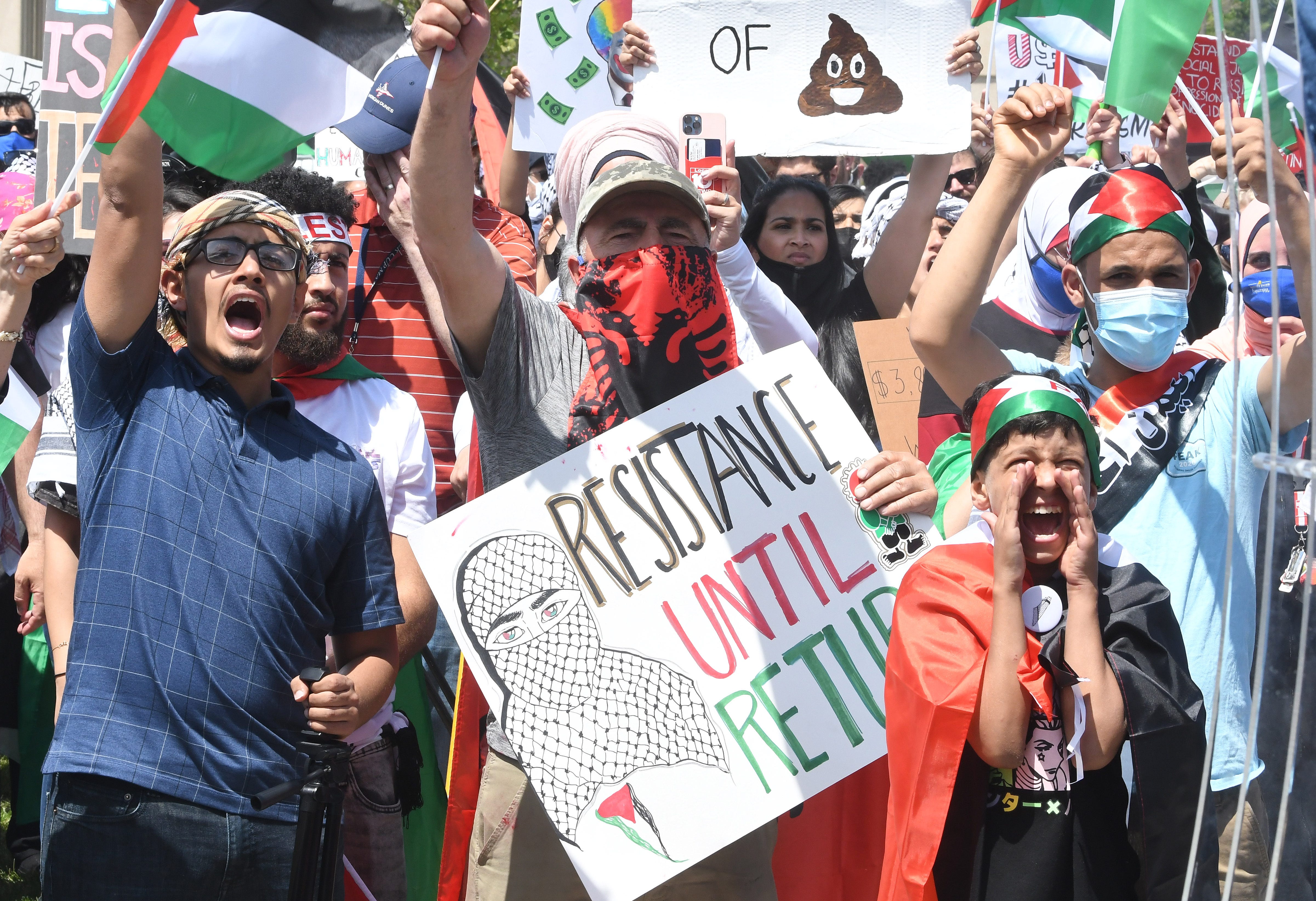 Thousands of Palestinian supporters listen to speeches during Palestinian protest and march, at the same time President Joe Biden is visiting in another part of Dearborn, Michigan on May 18, 2021.