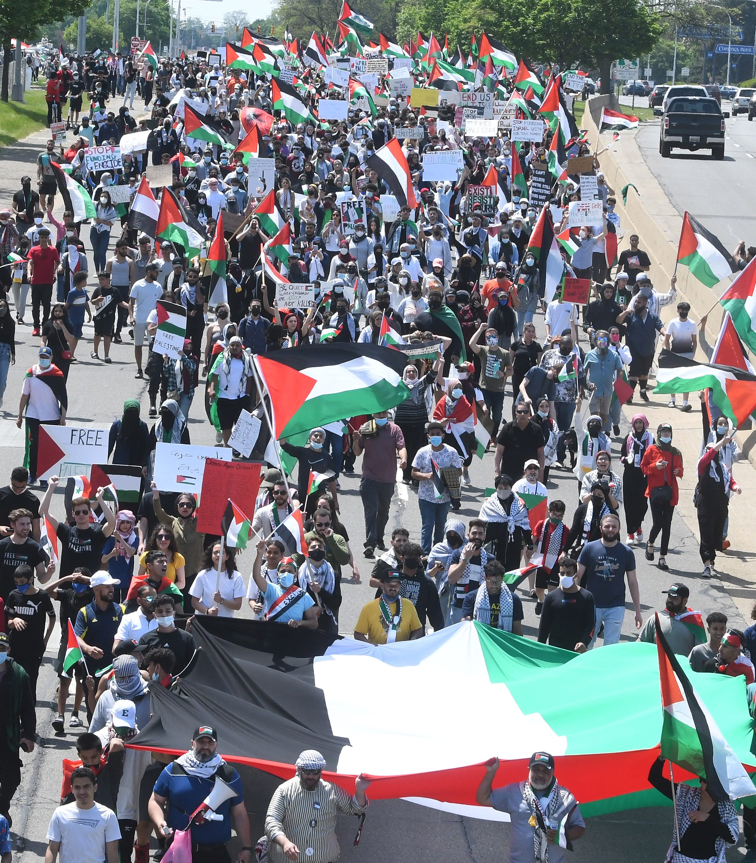 Thousands of Palestinian supporters march down eastbound Michigan Avenue during a Palestinian protest and march, at the same time President Joe Biden is visiting in another part of Dearborn, Michigan on May 18, 2021.