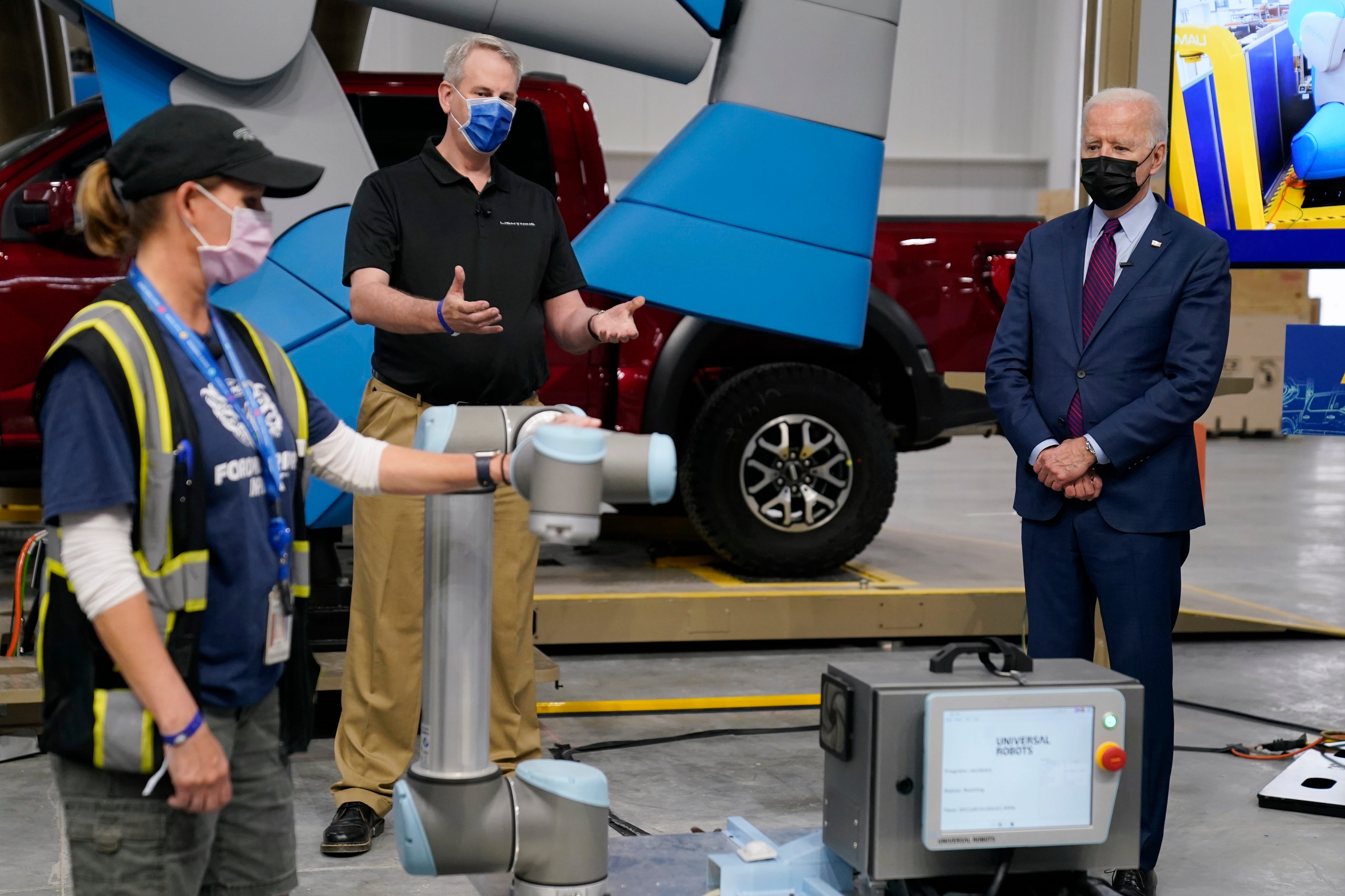 President Joe Biden listens during a tour of the Ford Rouge EV Center, Tuesday, May 18, 2021, in Dearborn.